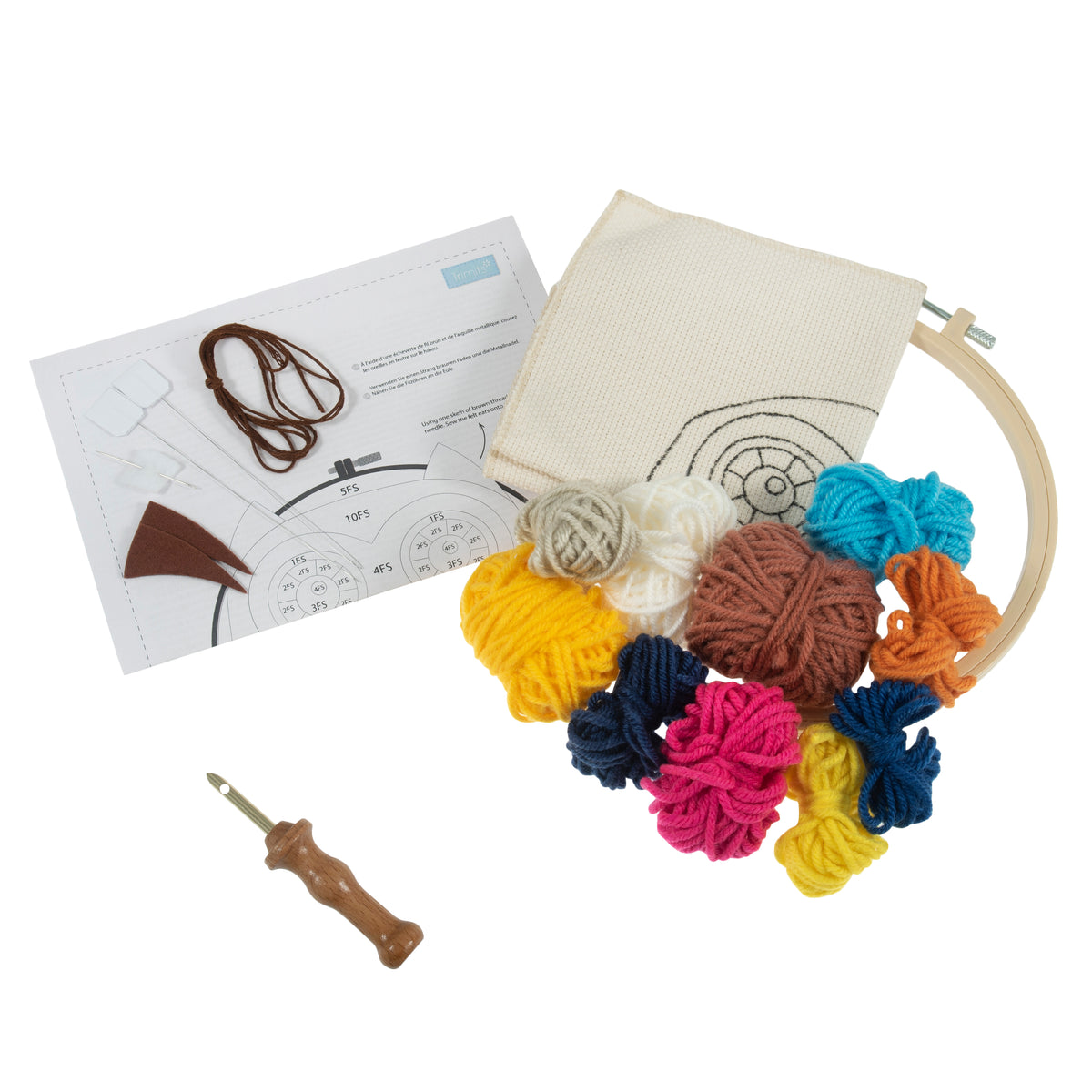 Owl punch needle kit including colorful yarn, hoop, fabric, punch needle tool, and instructions.