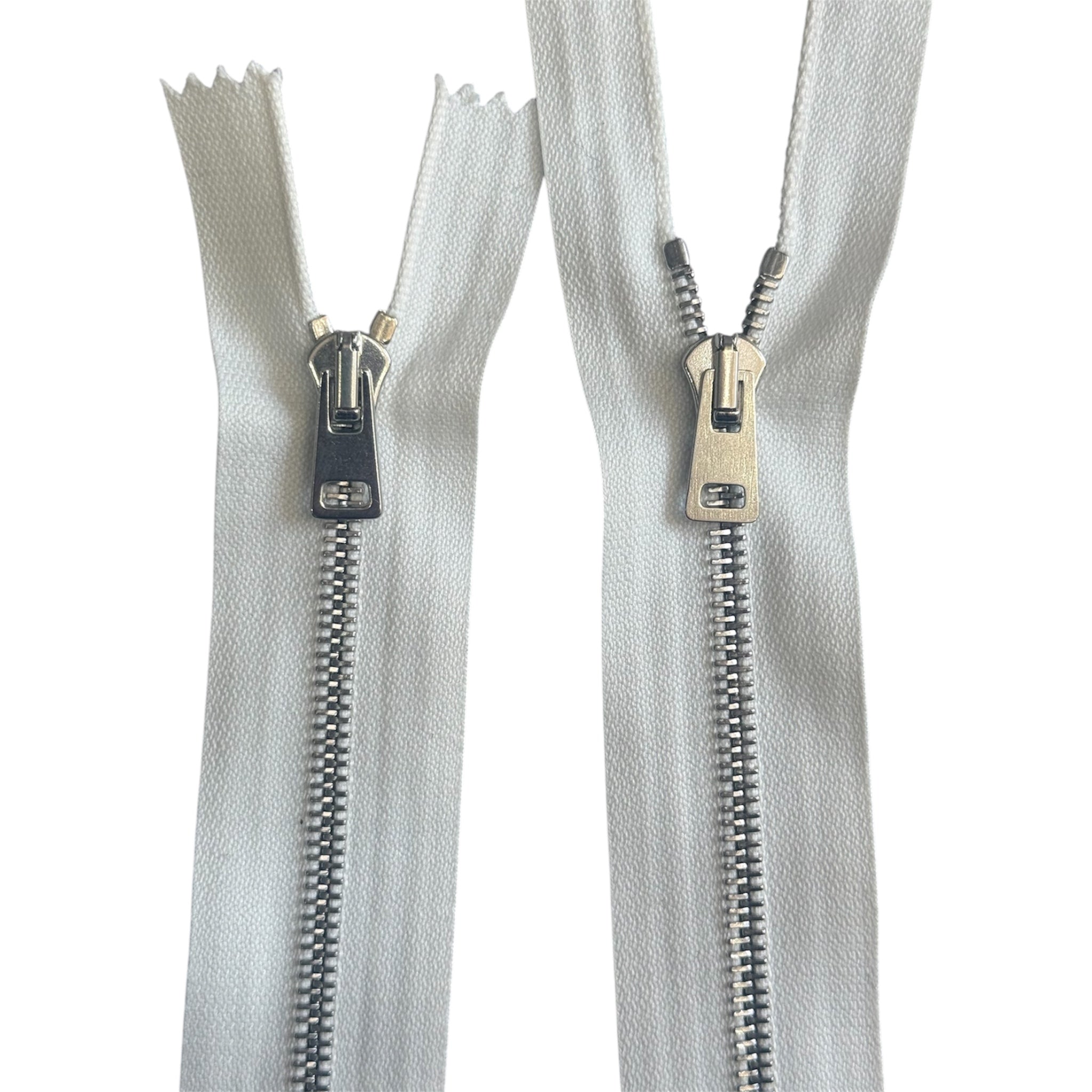 Two Riri 107cm white zippers with silver metal teeth and dual-opening sliders on a white background.