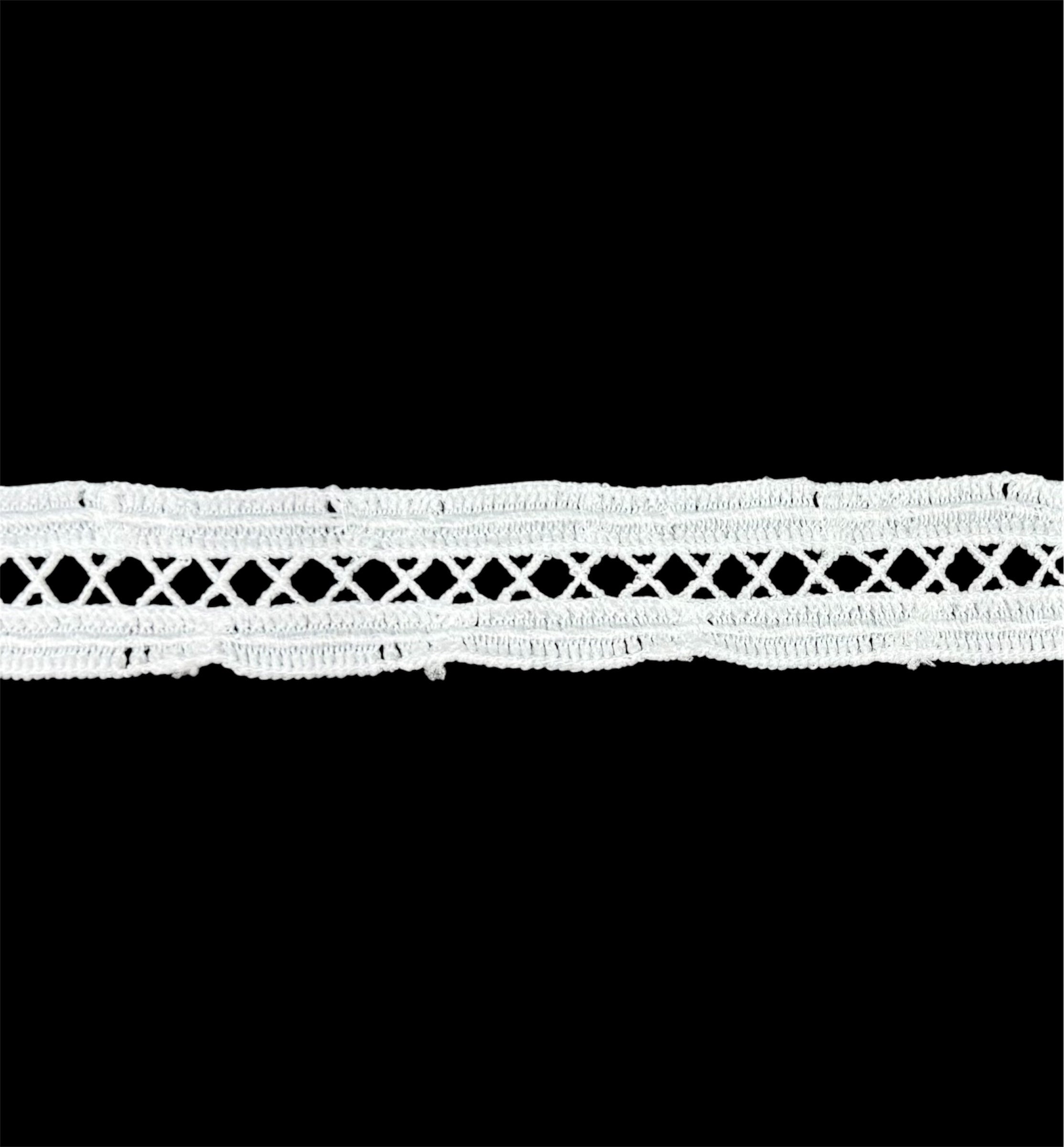 22mm white X-shaped lace trim with a decorative cross-stitch pattern on a black background.