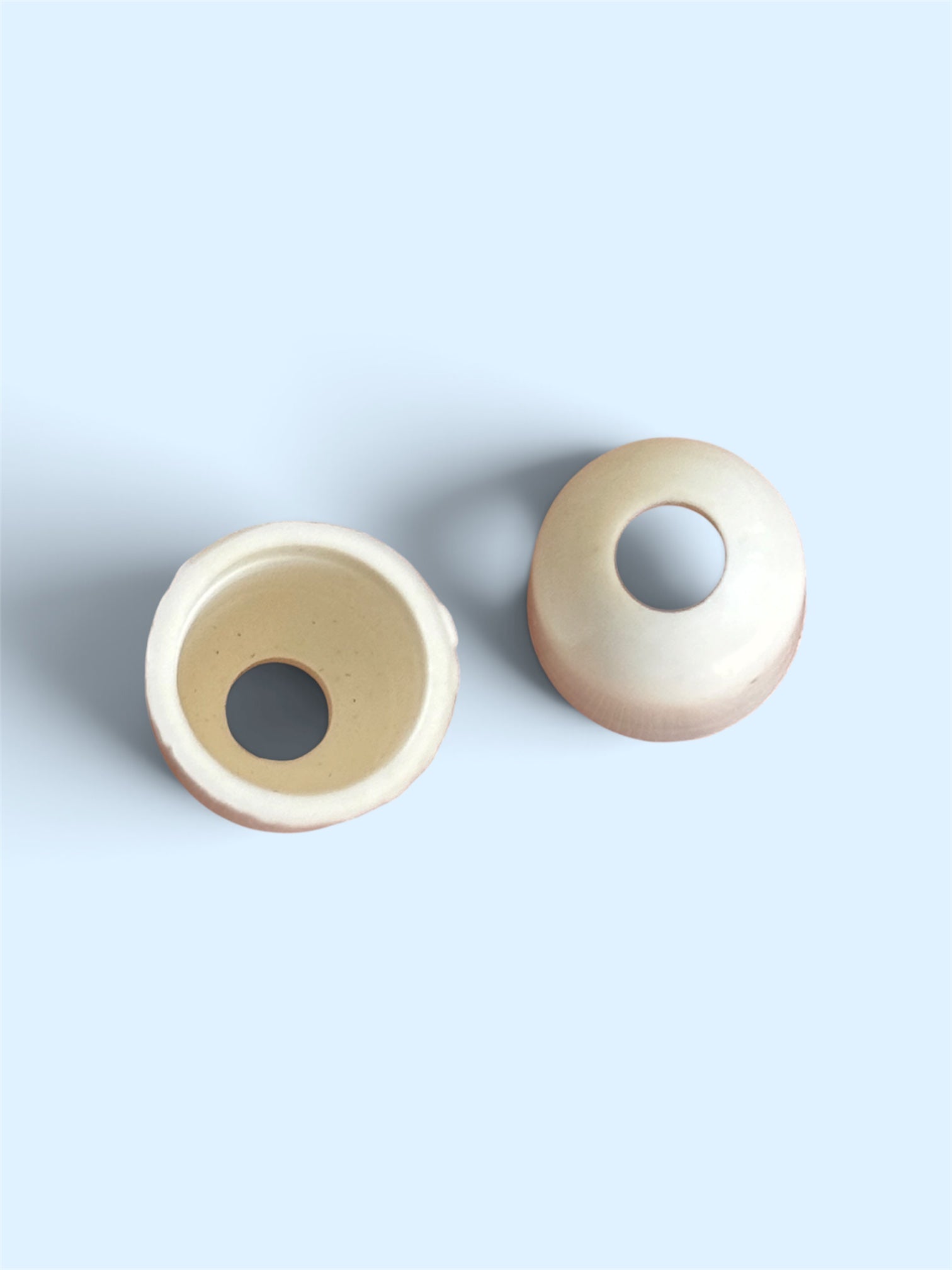 Two plain white 1-hole resin sewing buttons, 12mm x 15mm, shown from top and side angles.