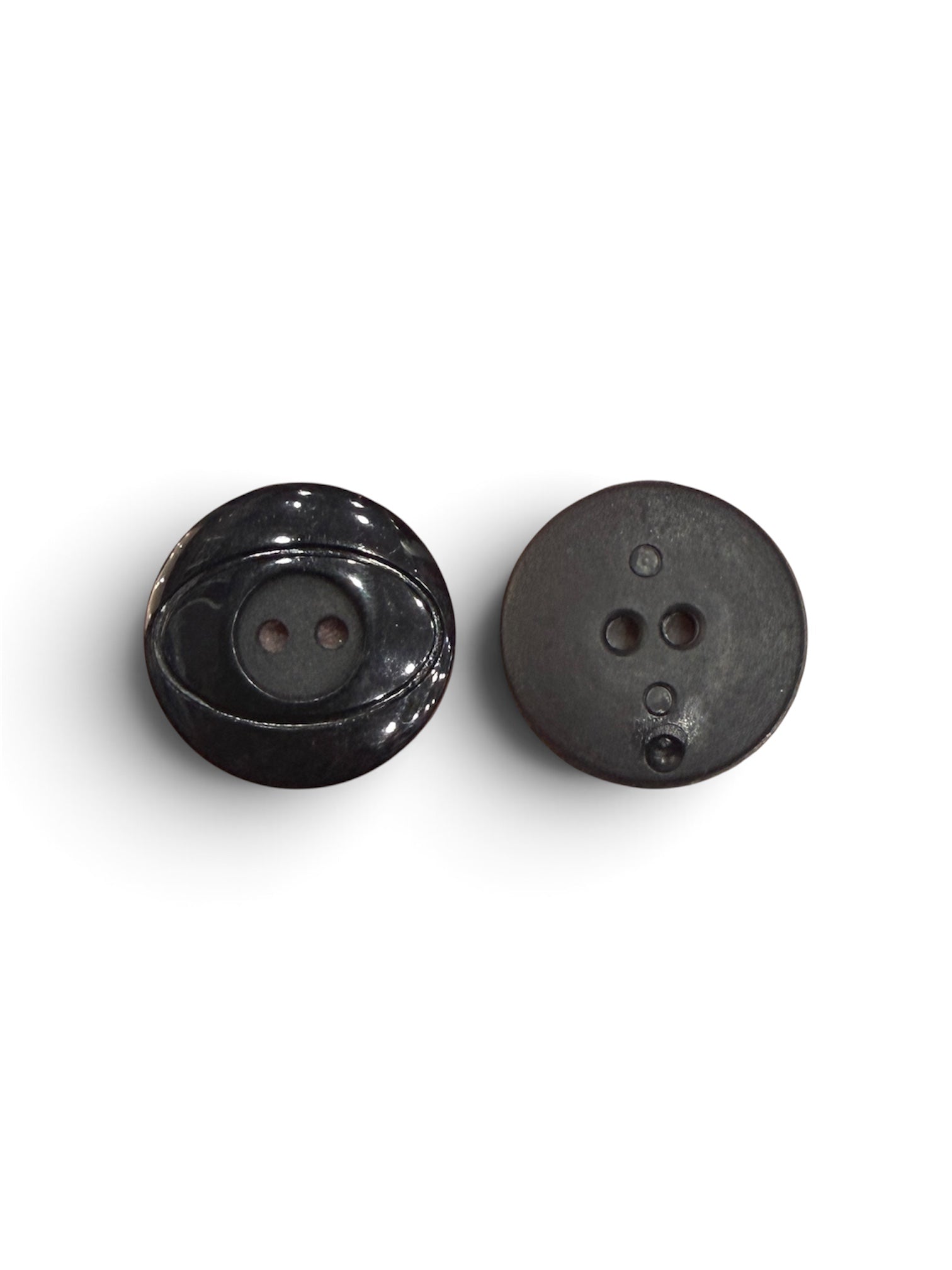 Front and back view of a 22mm black resin flat button with a 2-hole design on a white background.