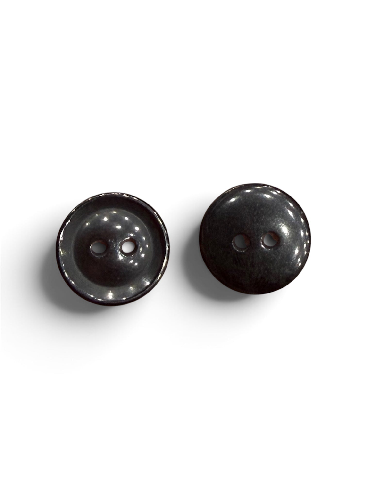 Two 13mm round black resin buttons with a polished finish and 2-hole design on a white background.