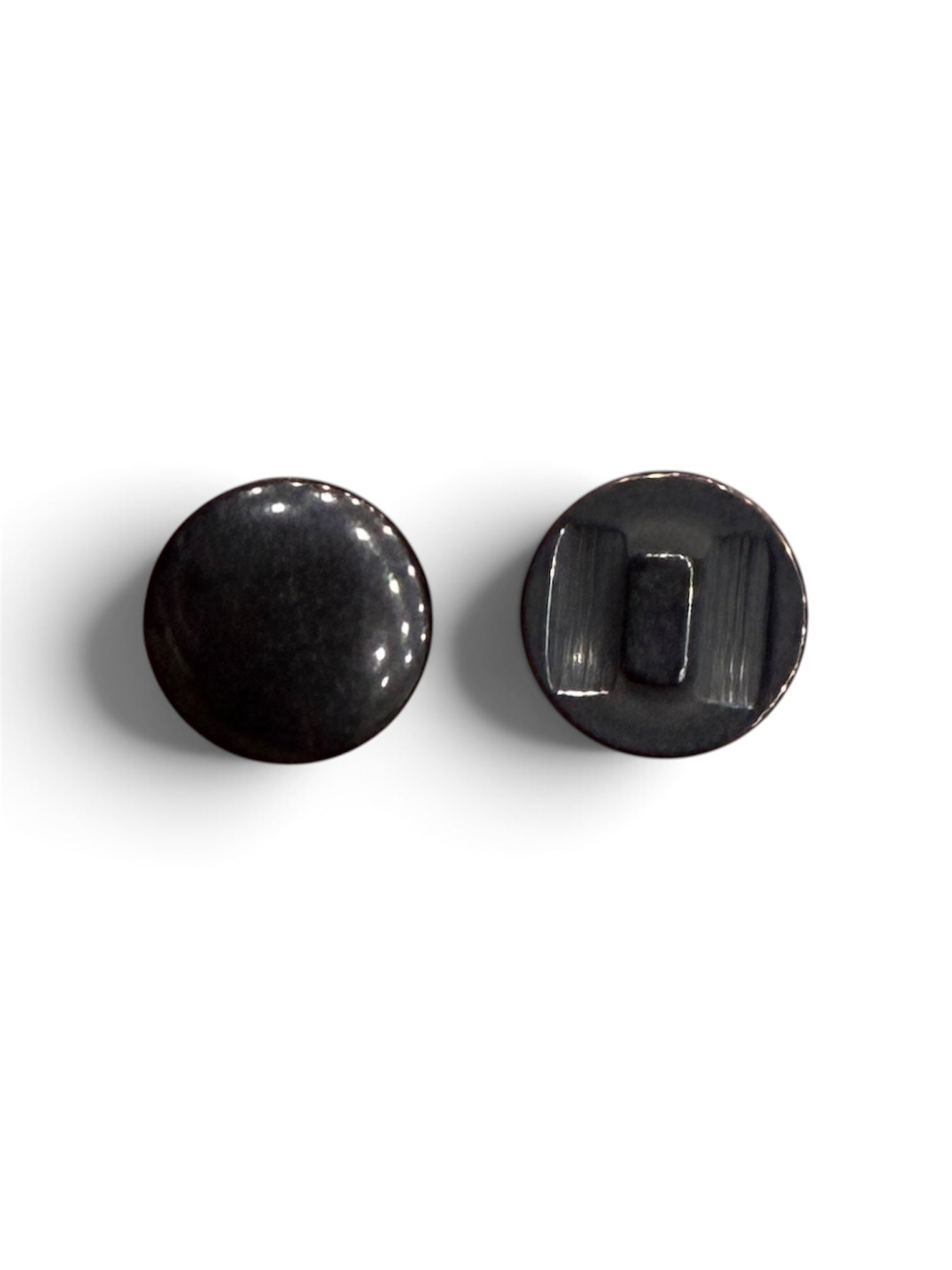 Front and back view of a 14mm round black resin sewing button with a polished finish.