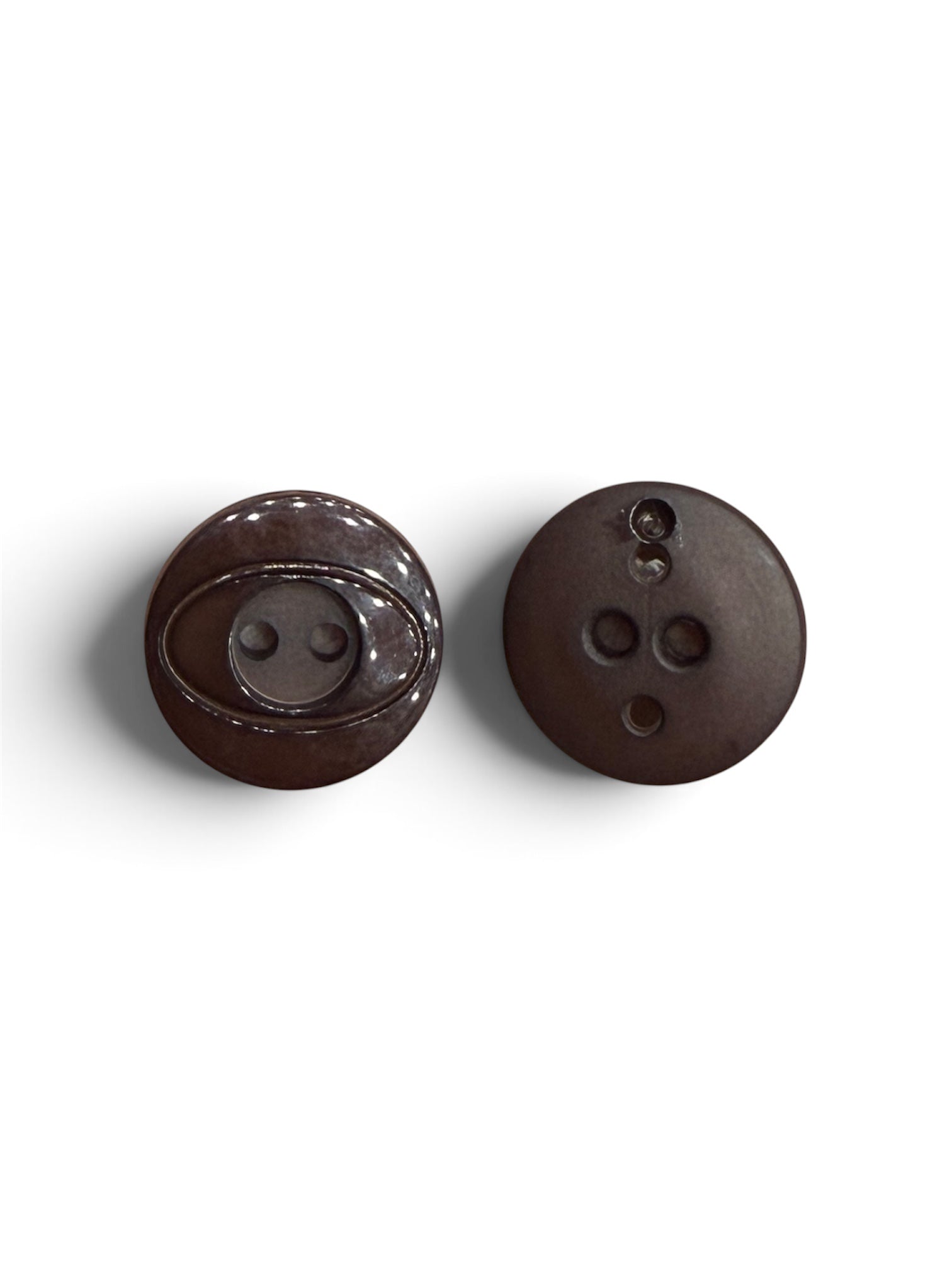 Front and back view of an 18mm round dark brown 2-hole sewing fastener button.