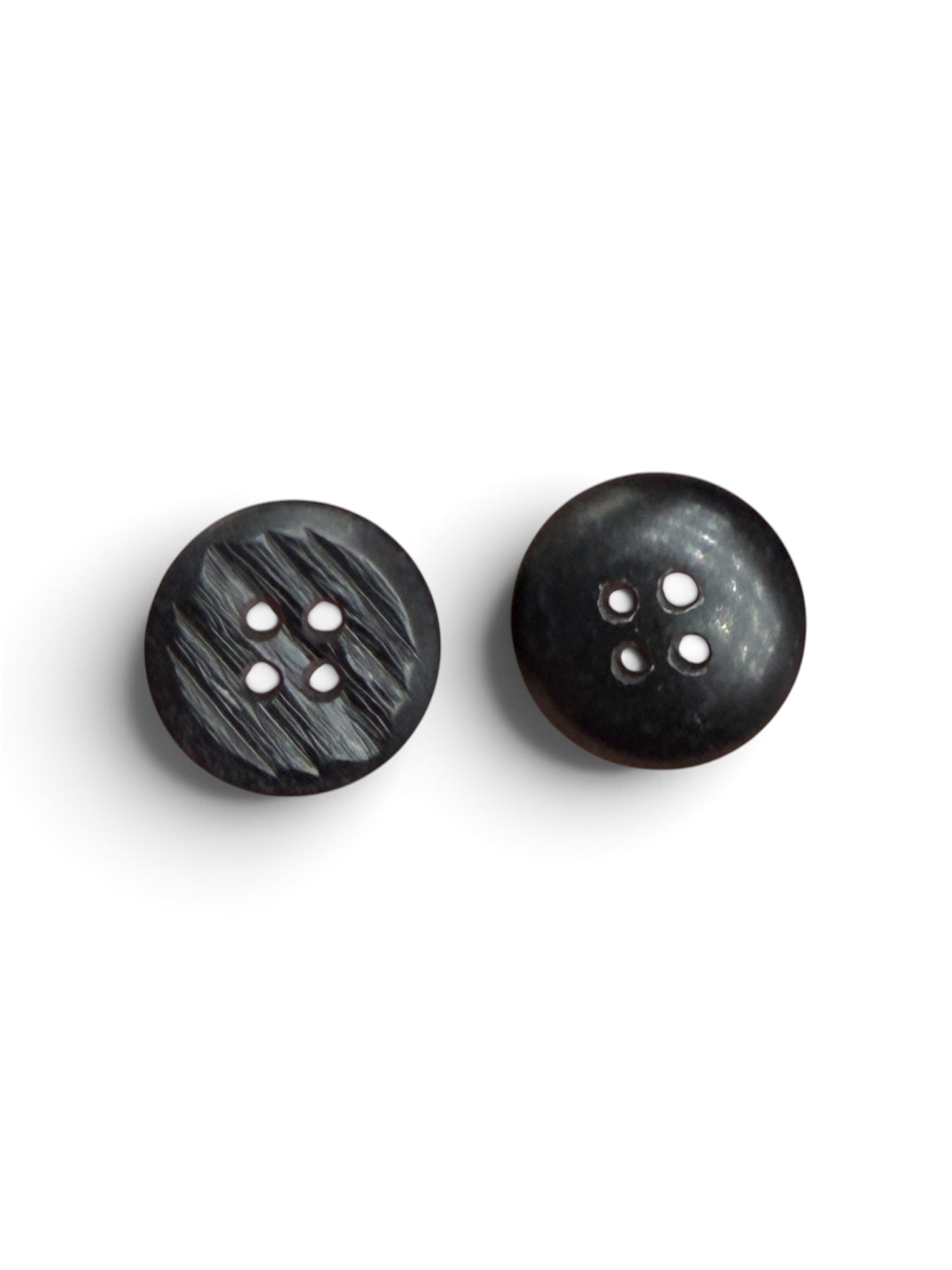 Two 15mm round black resin 4-hole sewing buttons, one with a textured finish and one smooth.