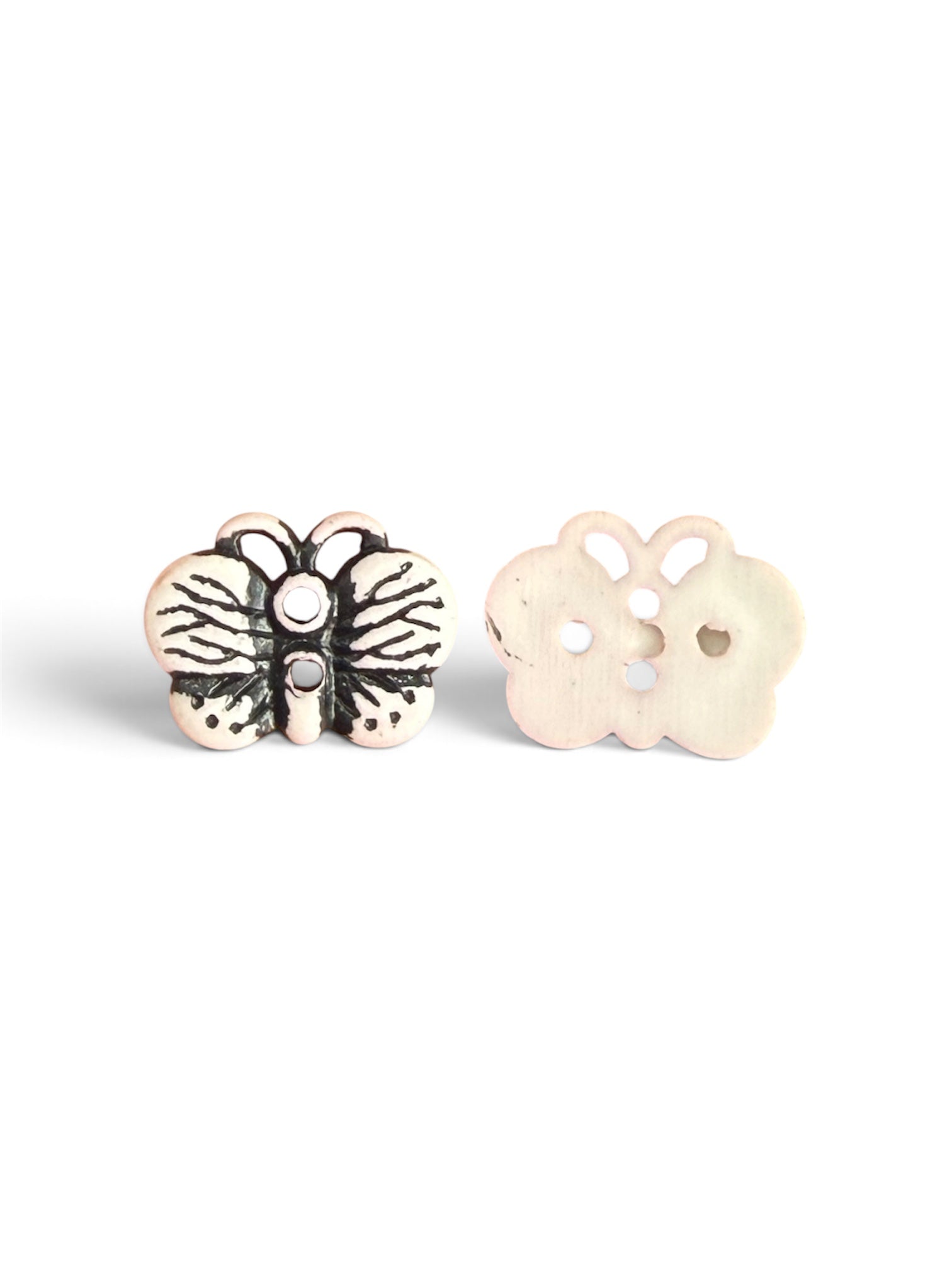 Two pink butterfly-shaped resin buttons, one showing black detailing and one plain back.