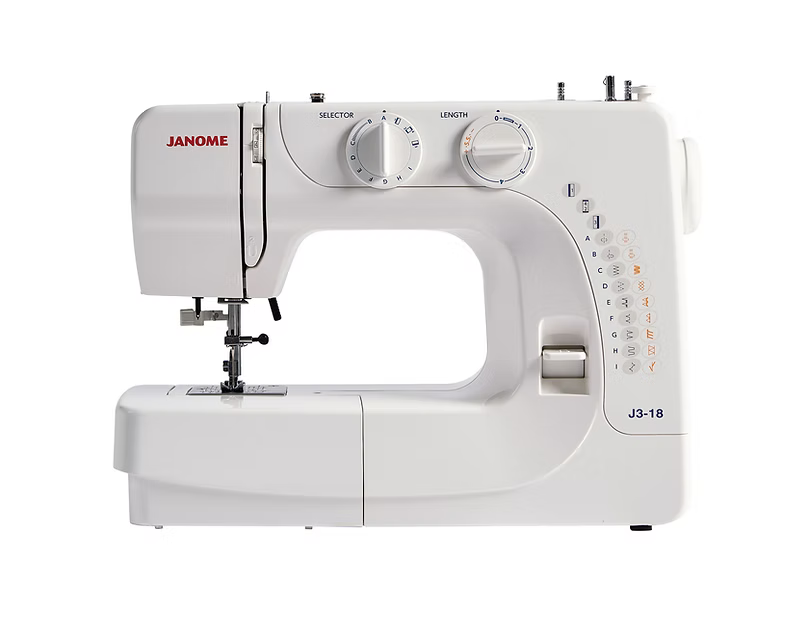 Janome J3-18 mechanical sewing machine with stitch selector and length dials.