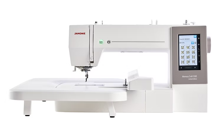 Janome MC550E computerized embroidery machine with a large touchscreen and extension table.