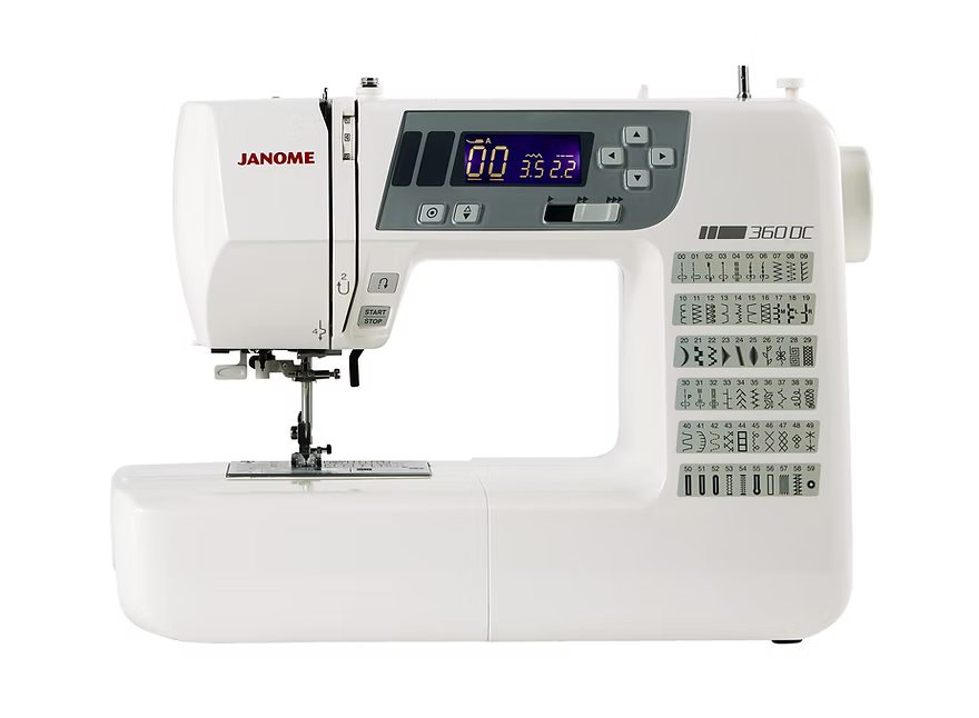 White Janome 360DC computerized sewing machine with digital display and stitch chart.