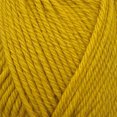 Close-up of mustard yellow Stylecraft Naturals Pure Wool DK yarn showing its twisted texture.