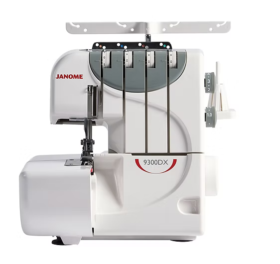 Janome 9300DX overlocker with thread guides and tension dials.