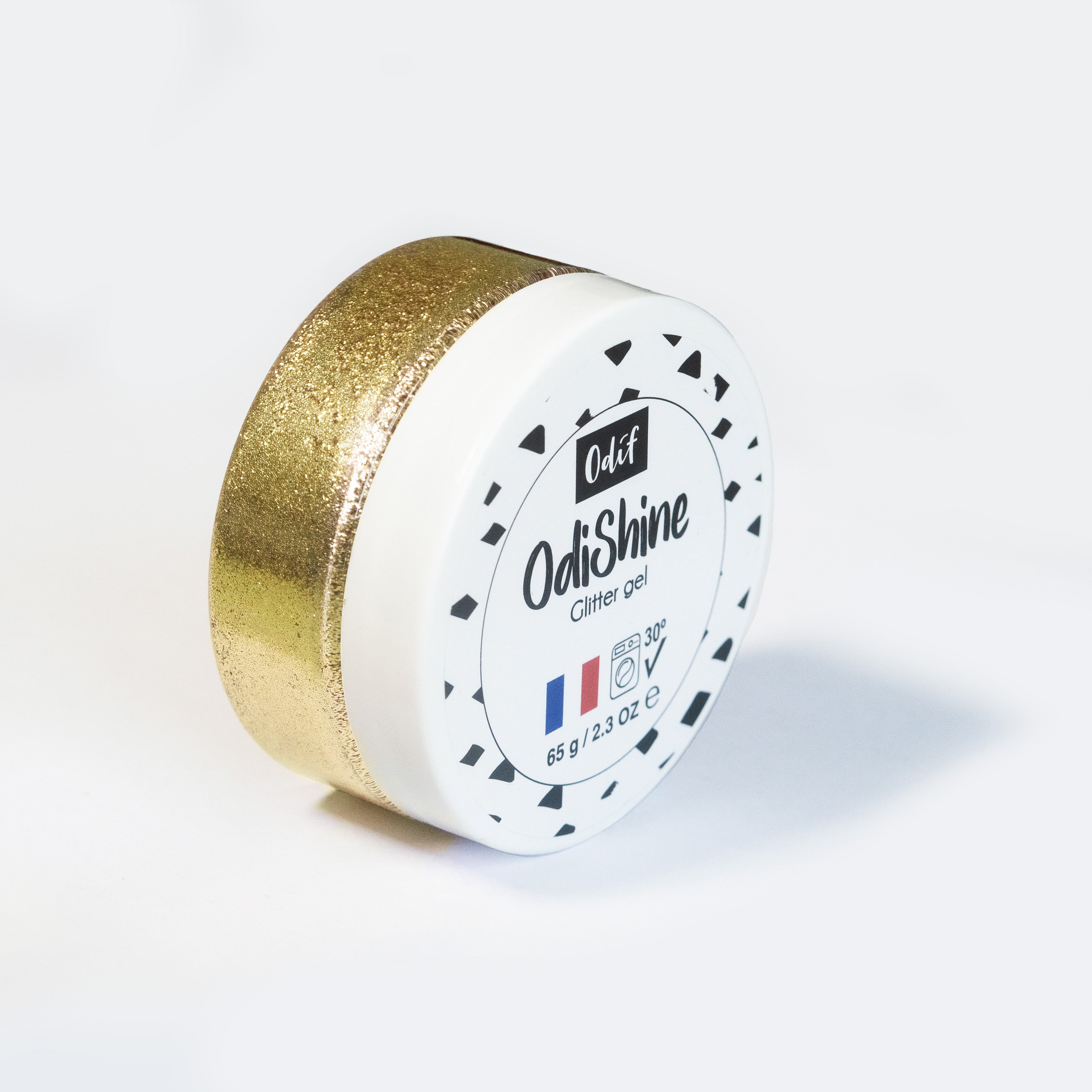 Odif OdiShine Gold Glitter Gel in a 65g white jar with gold glitter visible on the side.
