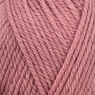 Close-up of Stylecraft Naturals Pure Wool DK yarn in Pale Rose, showing its twisted 100% wool fibers.
