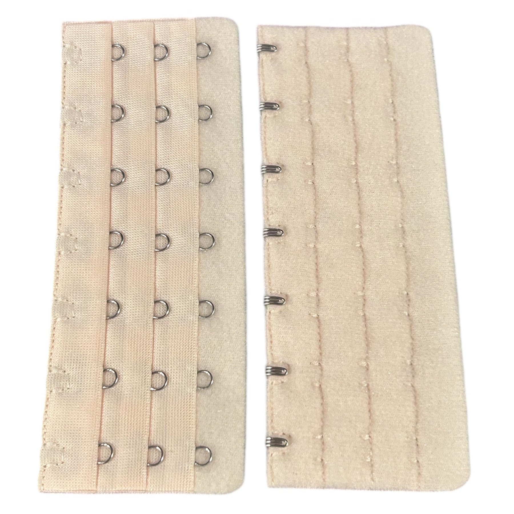 Nude polyester bra extender with multiple hook and eye closures.