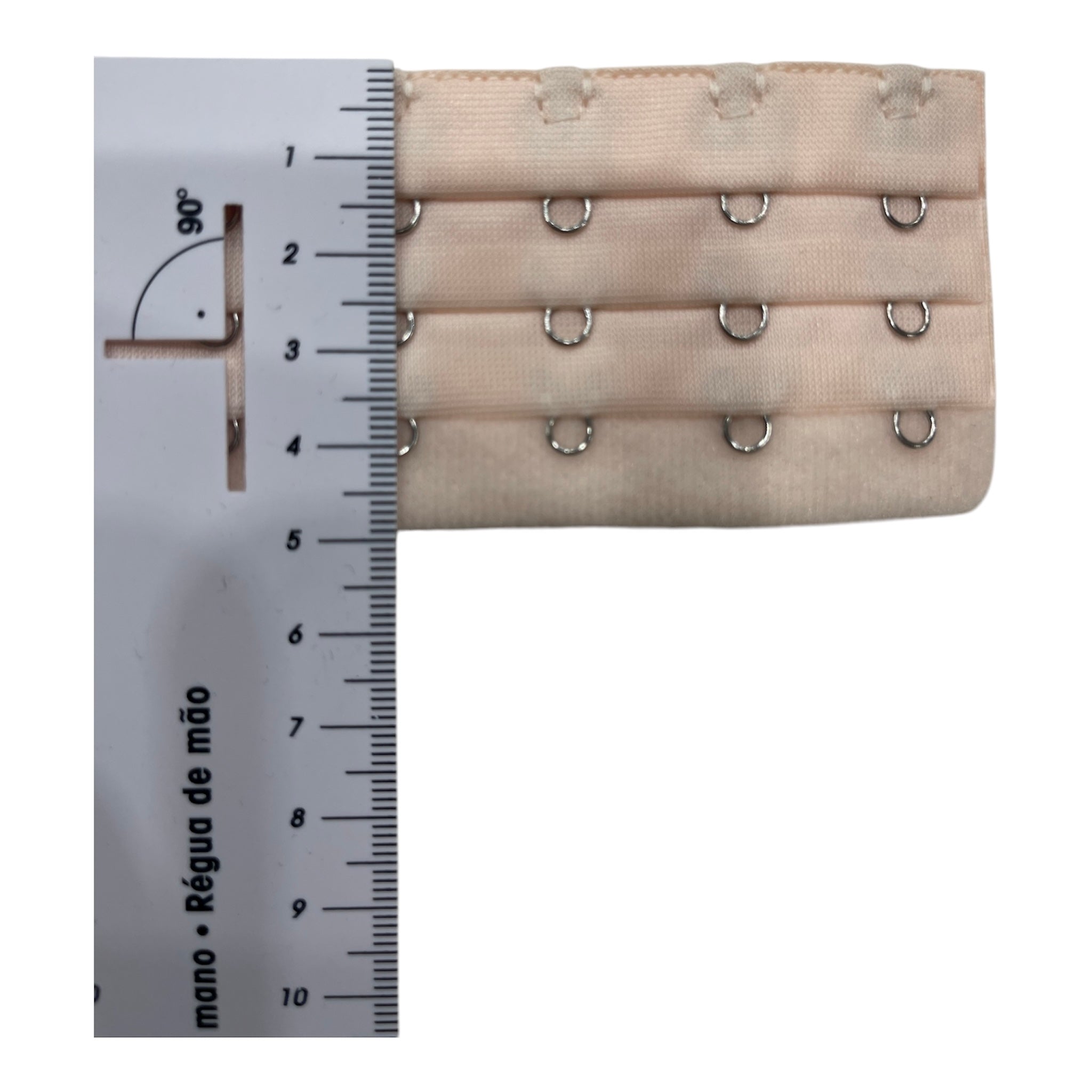 Bra extender with three rows of hooks and loops in nude polyester.