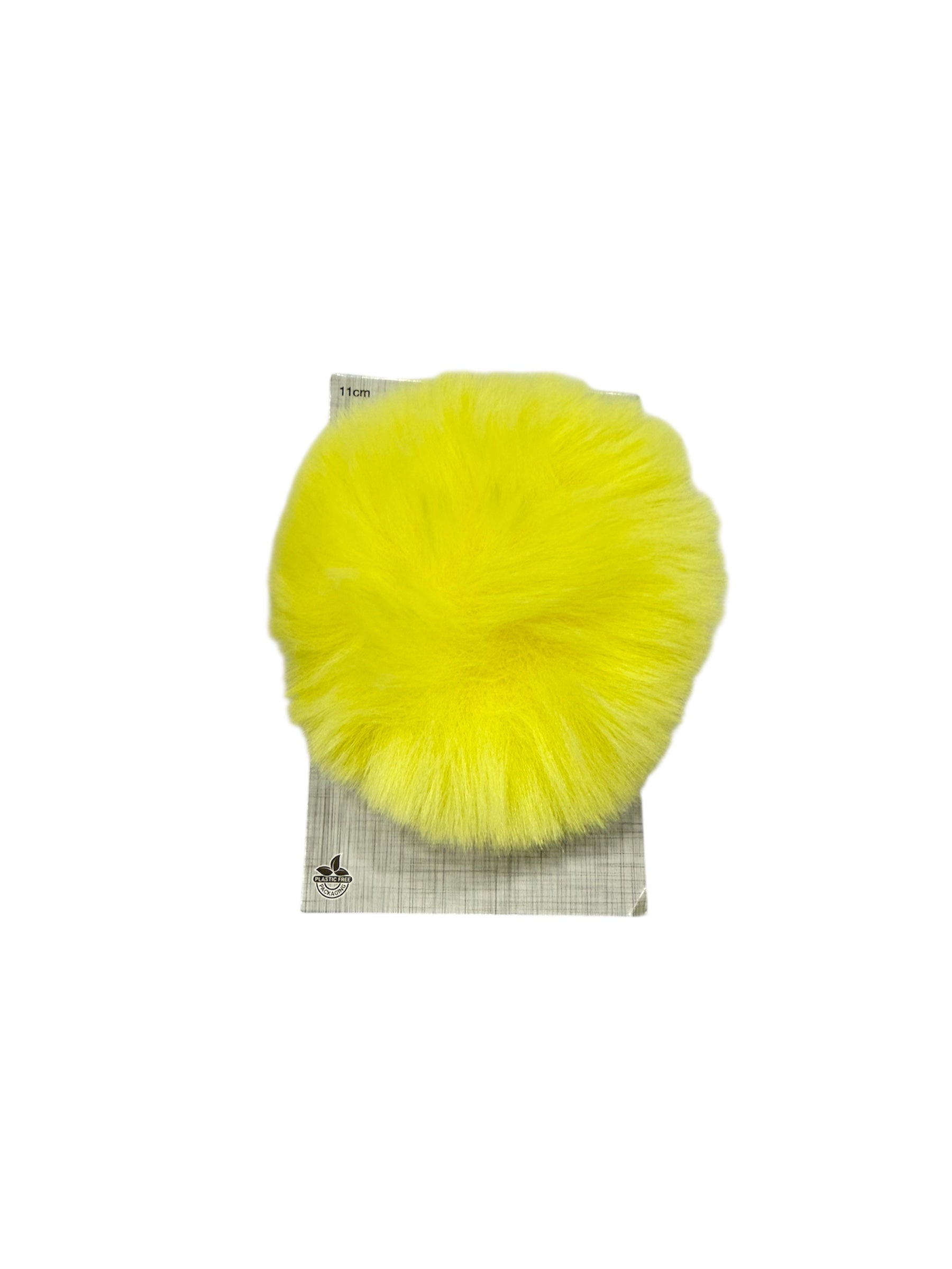 A bright yellow 11cm faux fur pompom on plastic-free packaging.