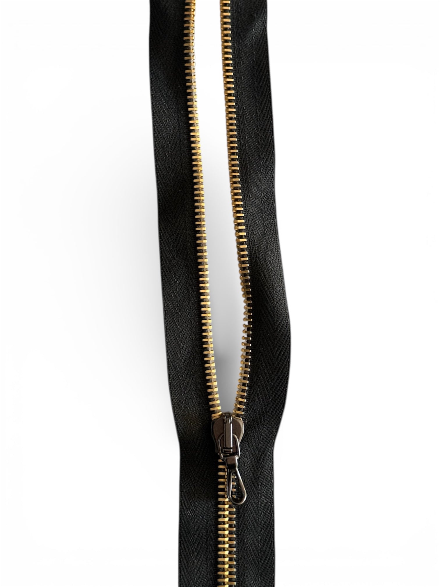 Lampo gold metal one way open end zip, 64cm length.