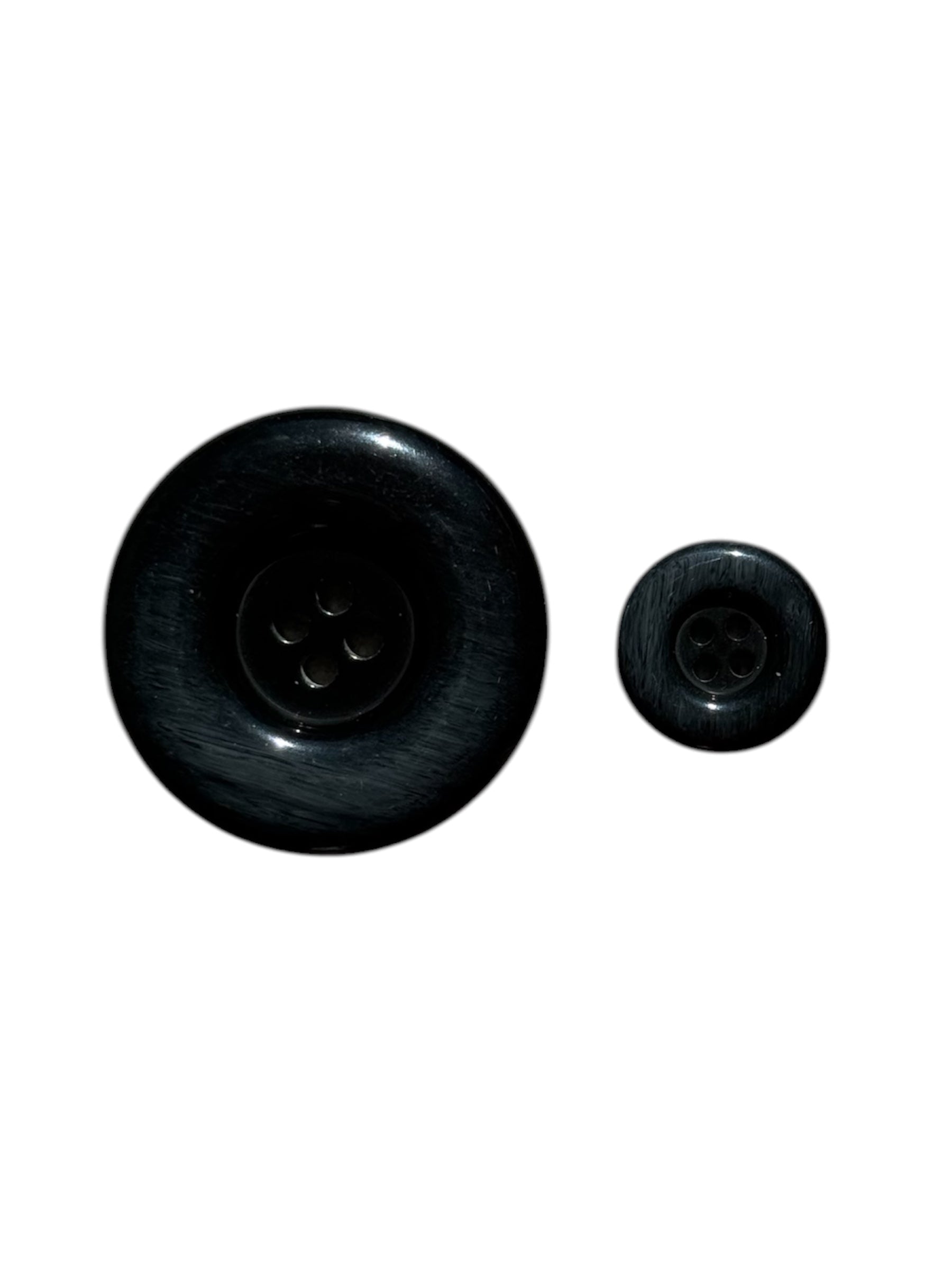 Two shiny black plastic buttons with a four-hole design shown in different sizes.