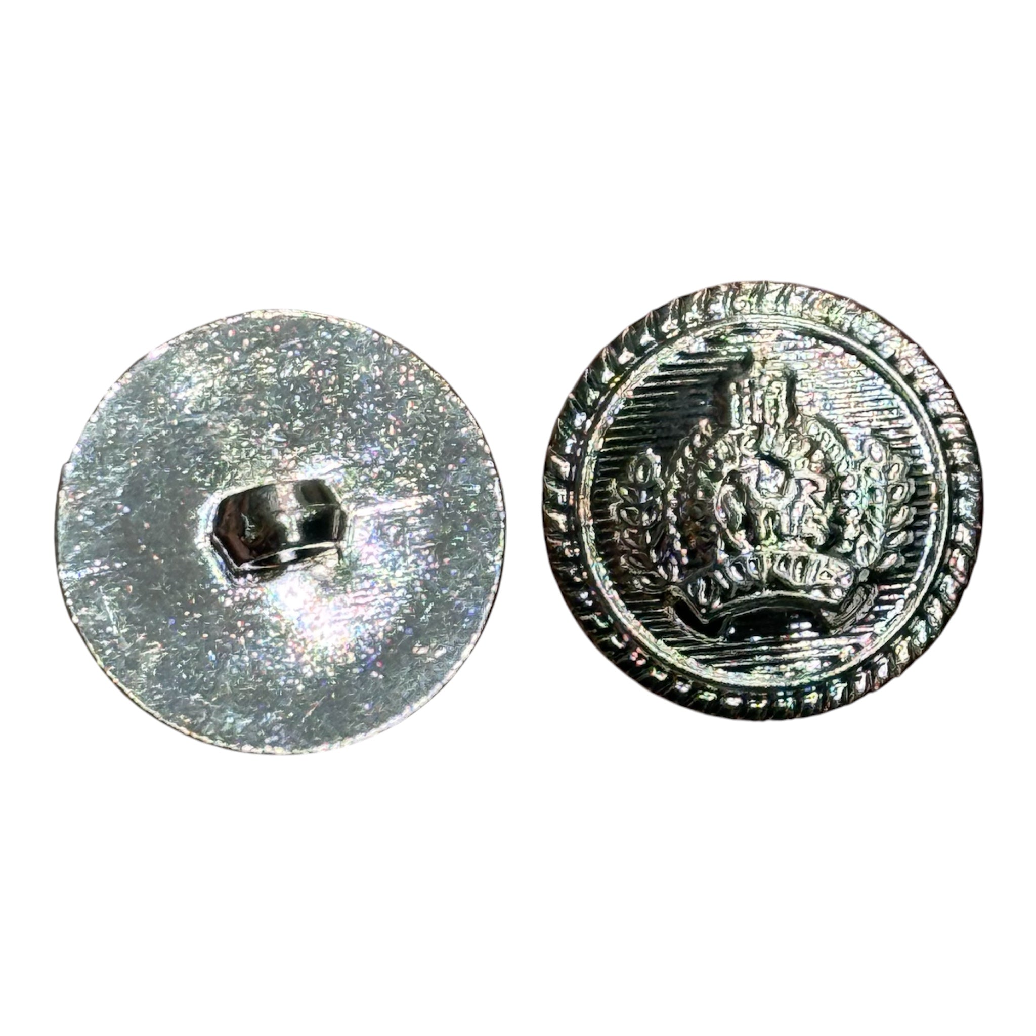 Front and back view of a 23mm silver textured button with a symbolic crest and shank back.