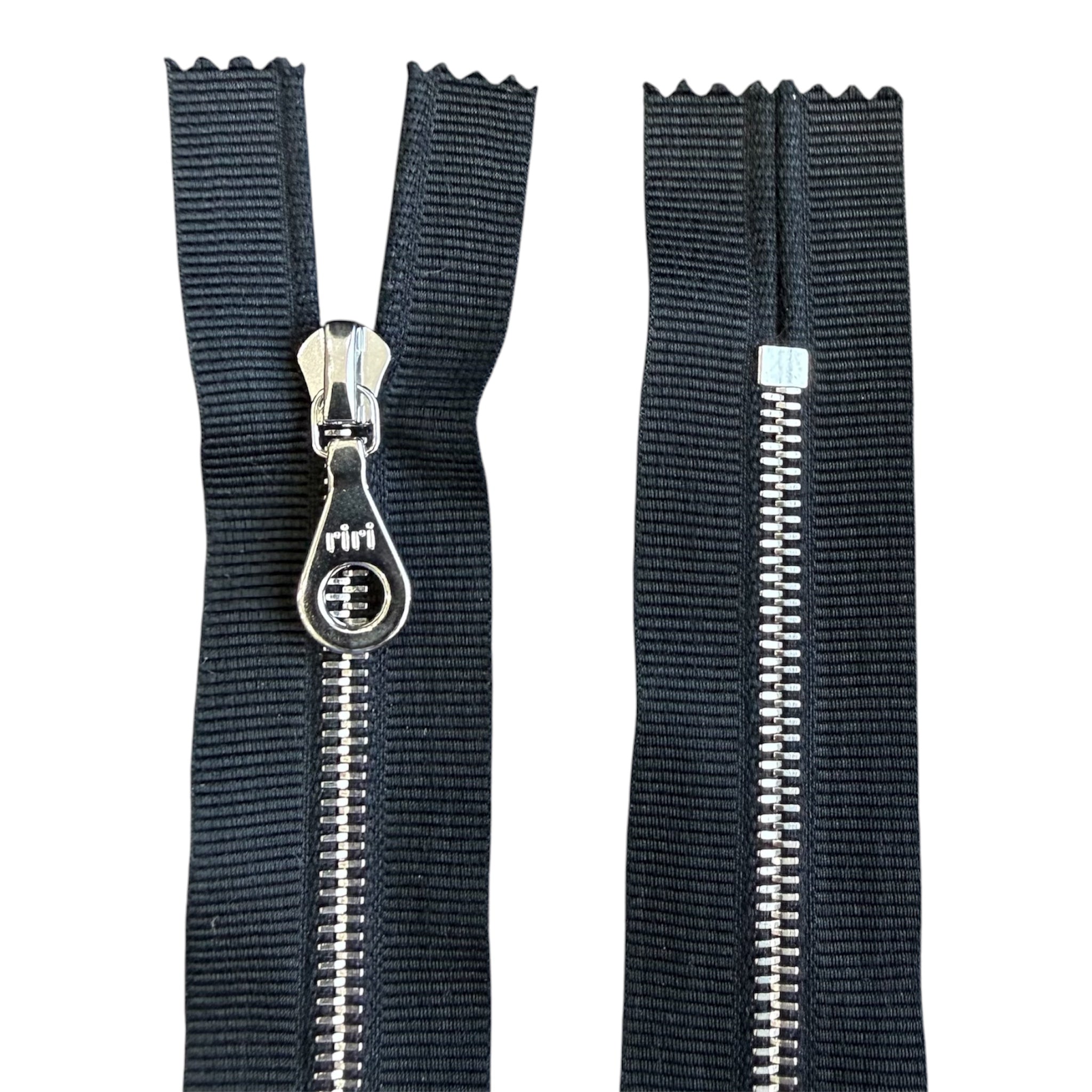 Riri 22.5cm closed ended zipper with black tape and silver metal teeth.