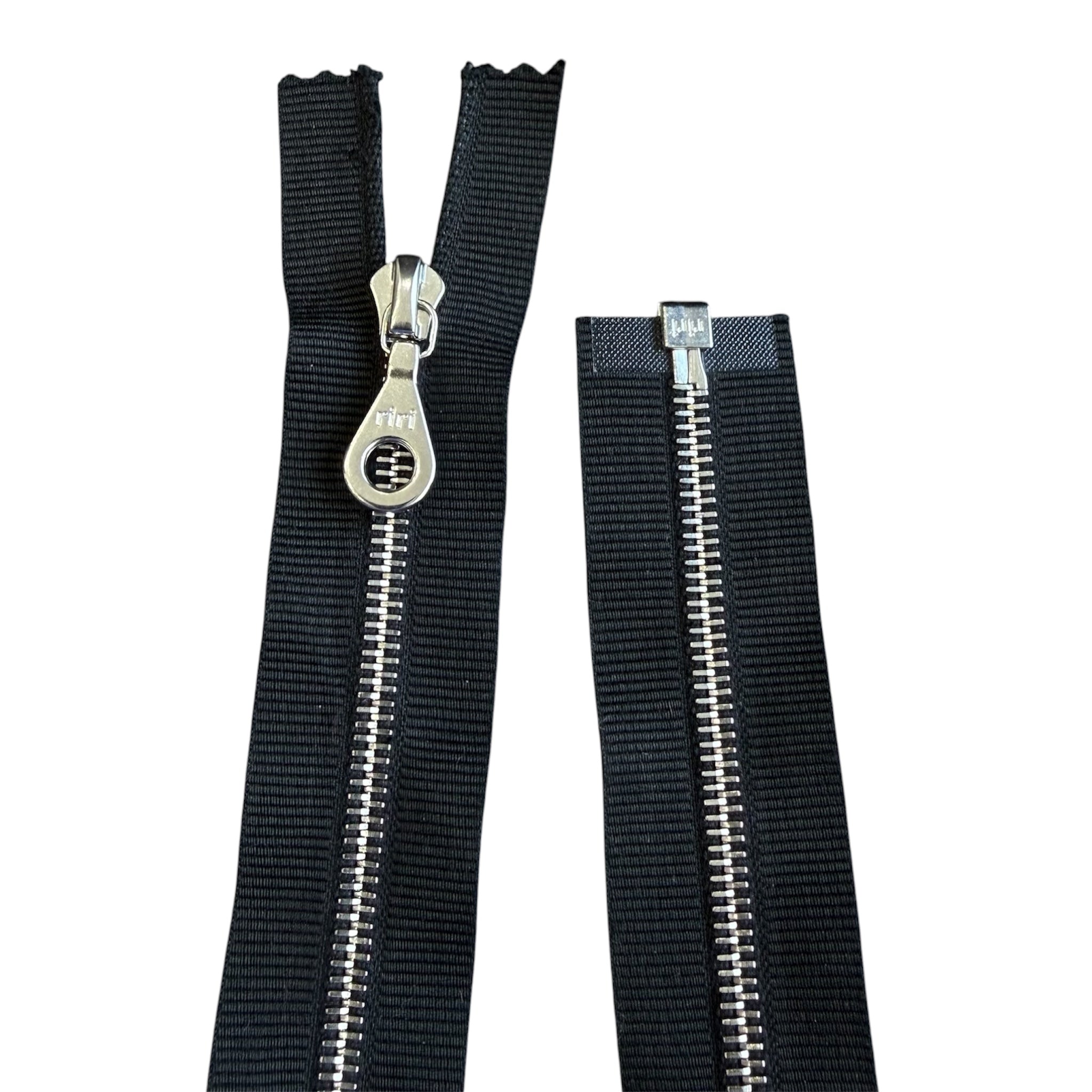 Riri 44cm open ended metal zipper with black tape and silver teeth.
