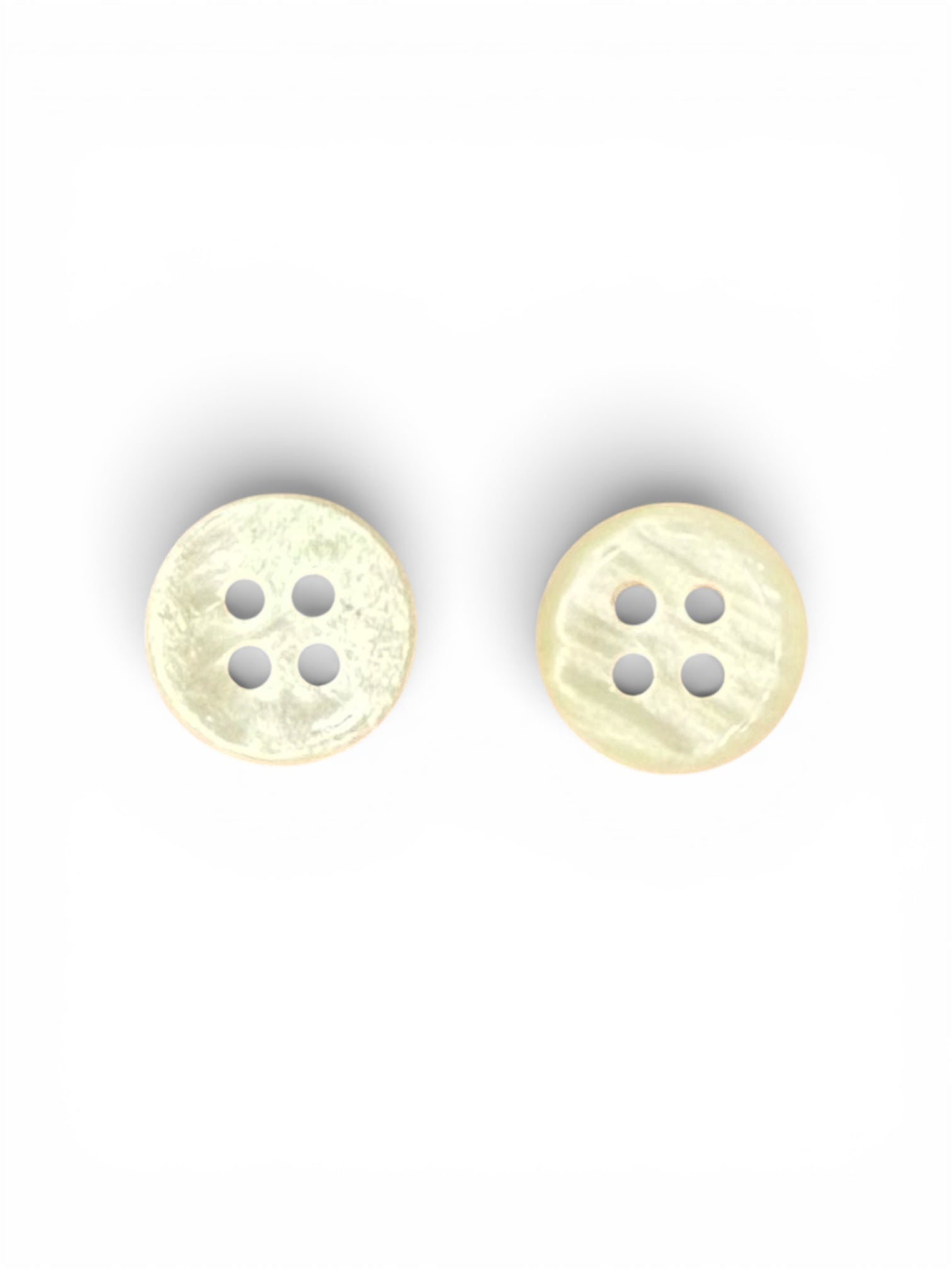 Two 10mm ivory resin 4-hole buttons with a smooth, neutral finish for garment construction.