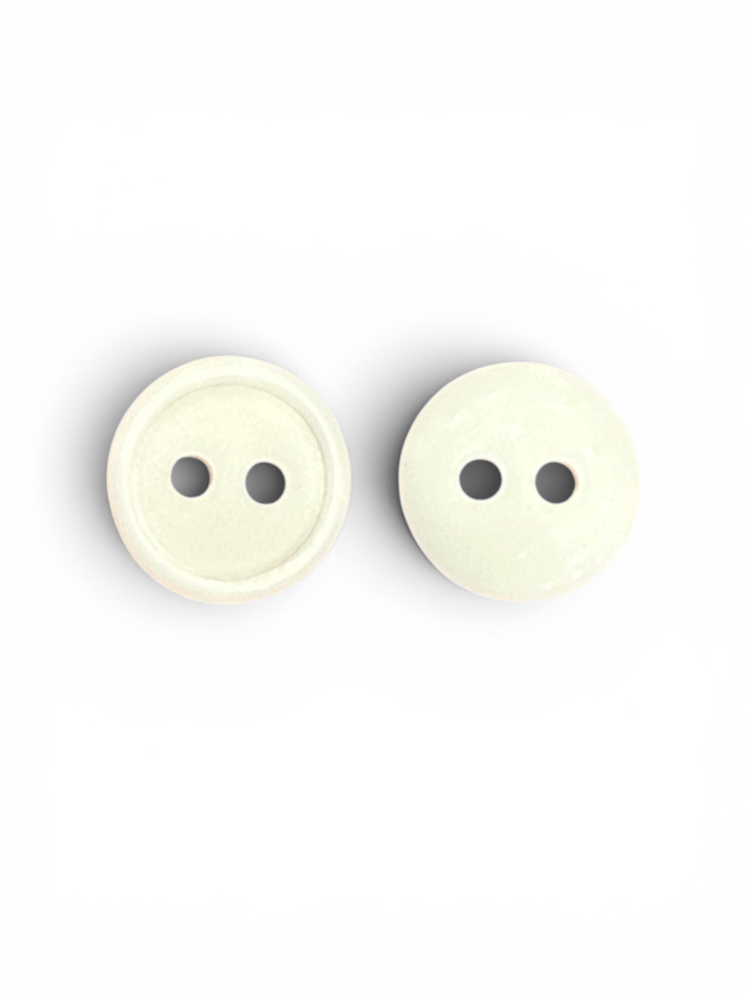 Two 12mm ivory round buttons with a 2-hole design on a white background.