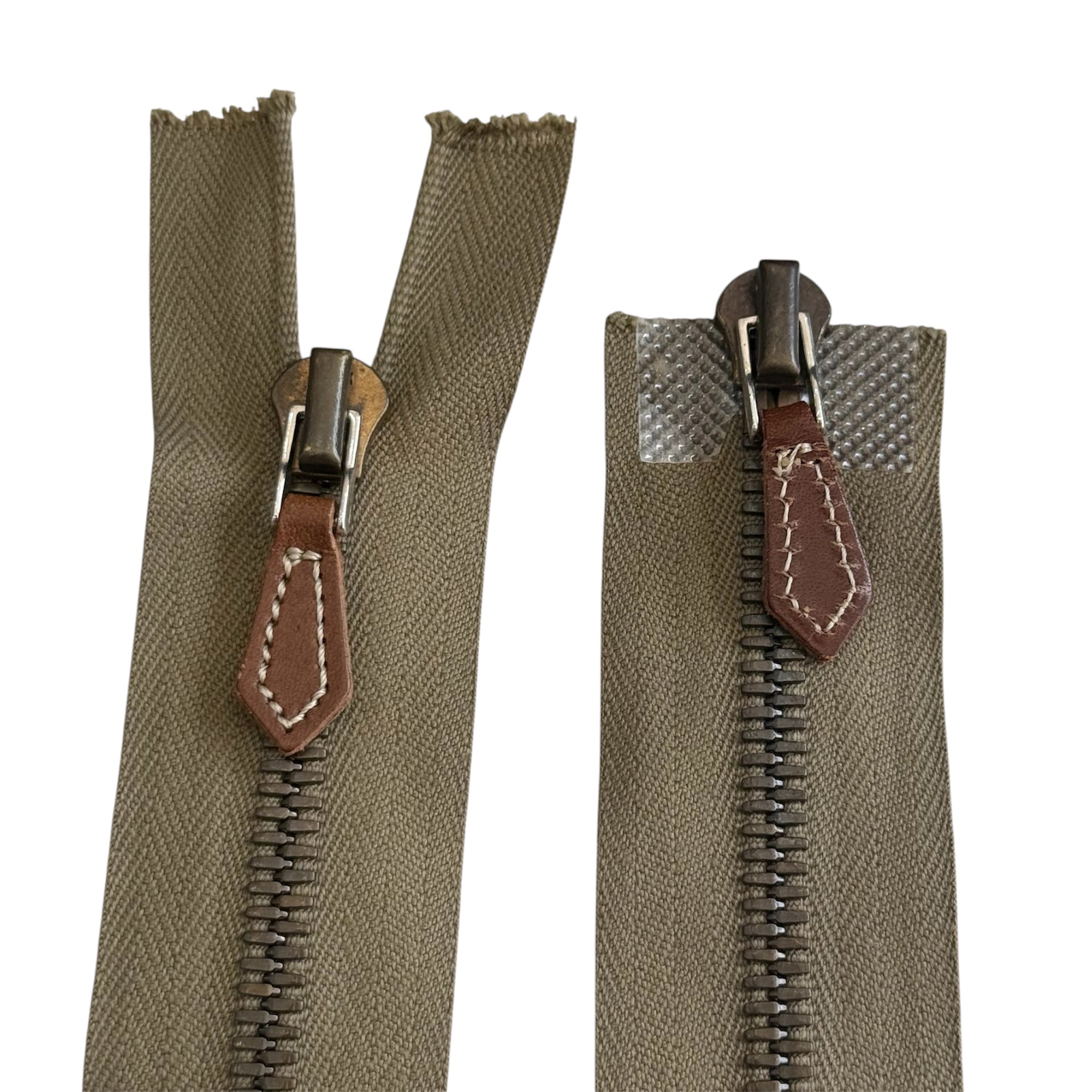 Riri 45cm metal zipper with olive green tape, metal teeth, and brown leather pull tabs.