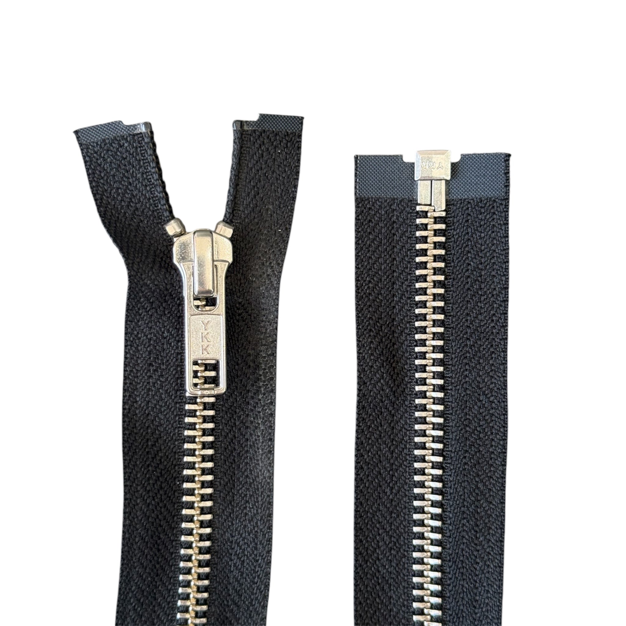 YKK 47.5cm open ended metal zipper with black tape and silver teeth shown open and closed.