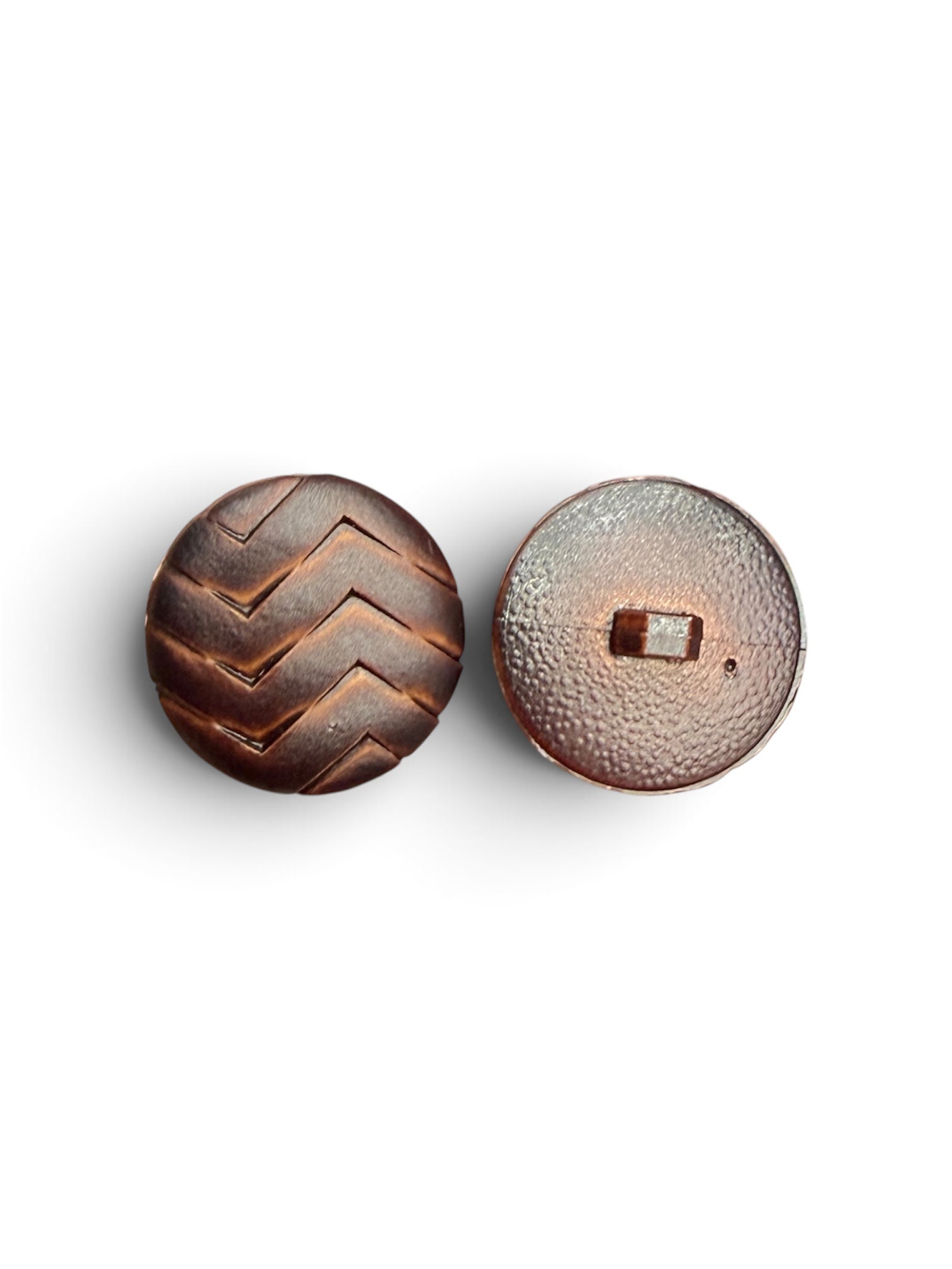 Front and back view of a 26mm brown round resin button with a textured chevron pattern.