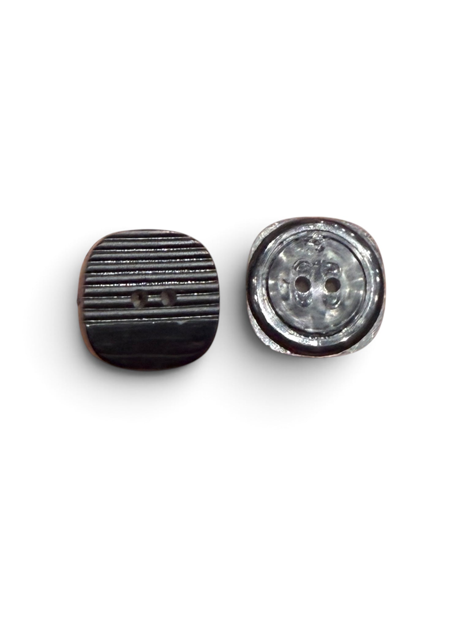 Front and back view of 21mm textured black 2-hole resin buttons with horizontal ridges.