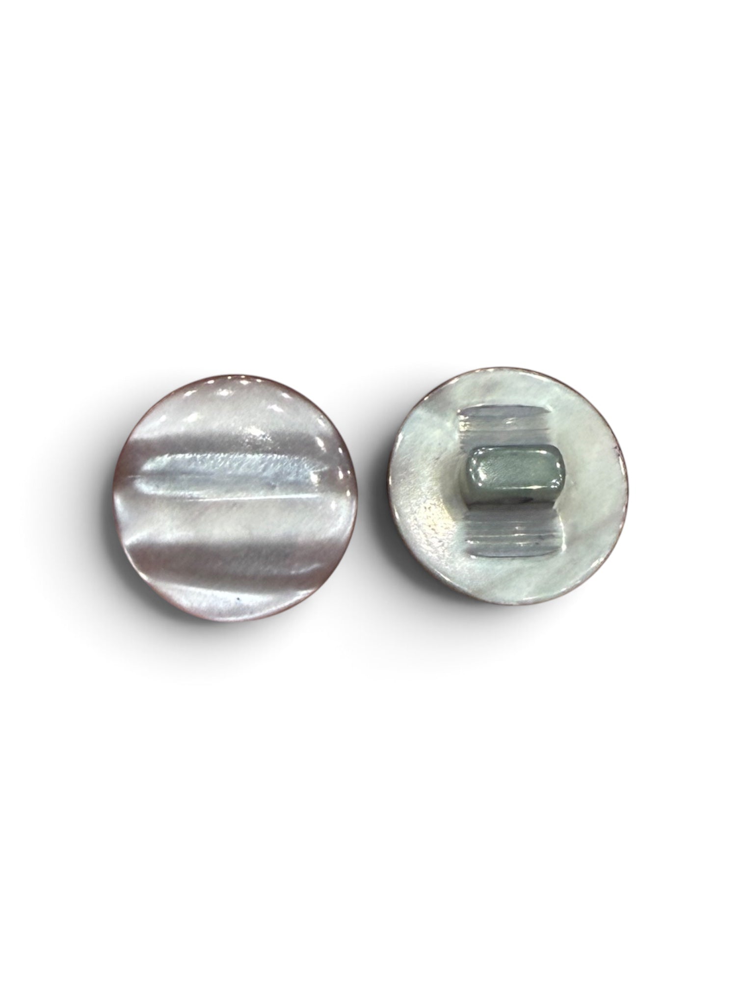Two round, polished grey resin buttons with a shiny finish.