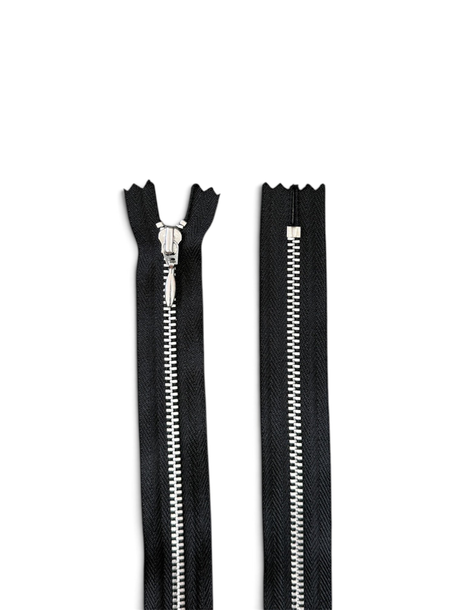 YKK 56cm black closed-ended zipper with silver metal teeth and puller.