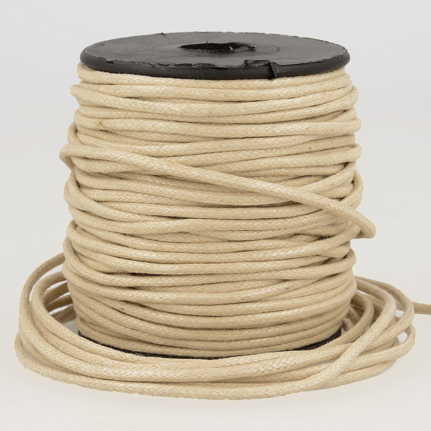 Spool of 2mm beige faux leather cord with a braided texture on a black plastic reel.