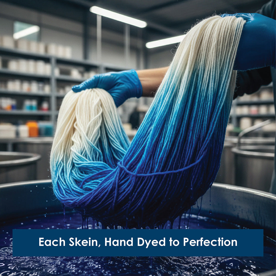 A hand-dyed 100g skein of blue and white Terra sock yarn being lifted from a dye bath.