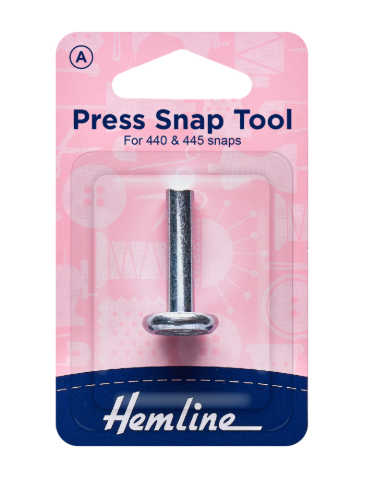 Hemline snap fastener tool in pink and blue packaging for applying A series press snaps.