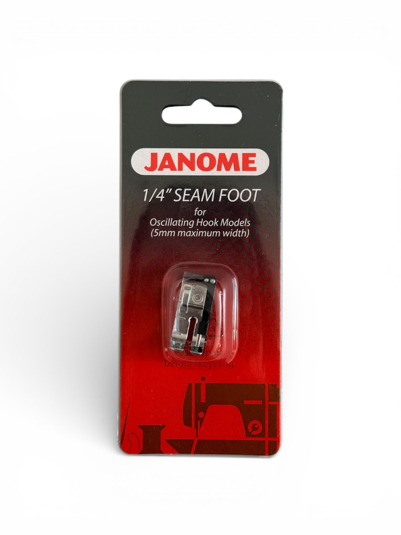 Janome 1/4 inch seam foot for oscillating hook sewing machines in its original red and black packaging.
