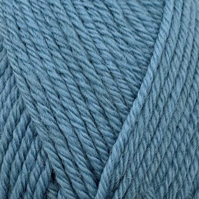 Close-up of Stylecraft Naturals Pure Wool DK yarn in Storm Blue showing twisted fiber texture.
