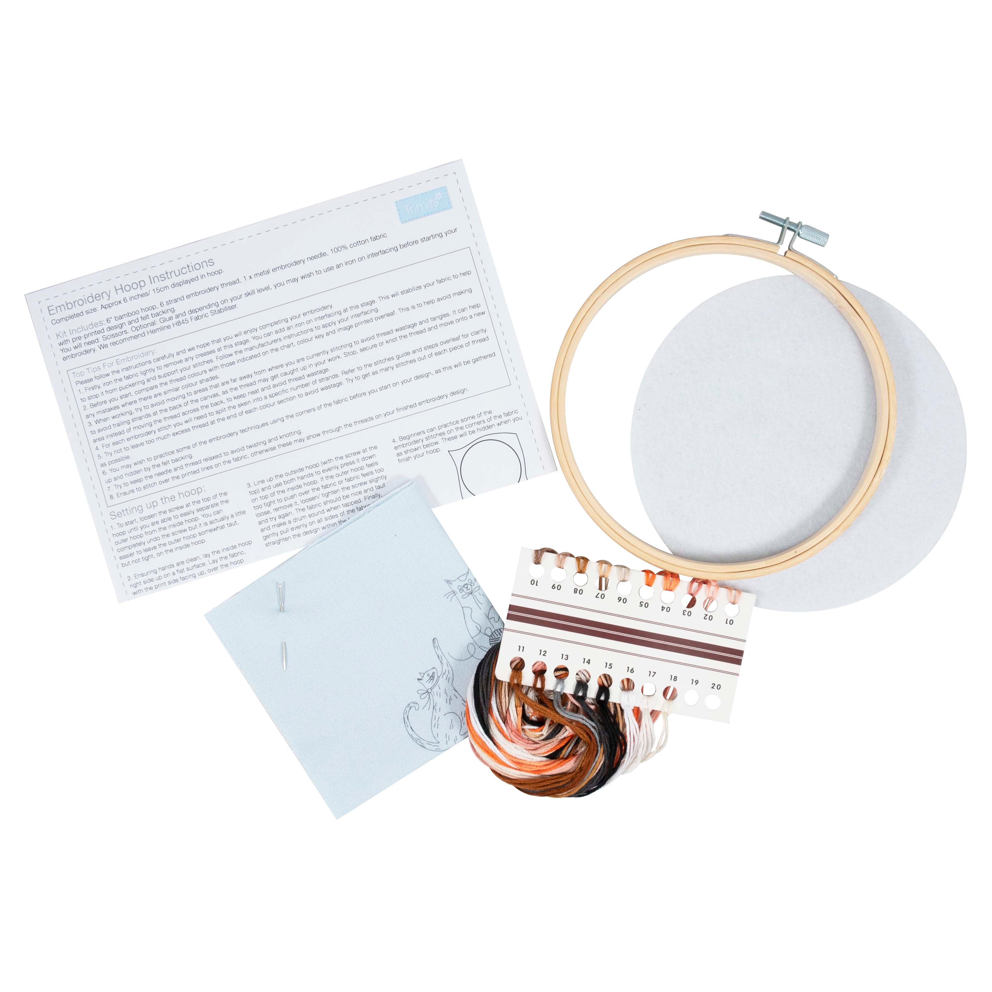 Embroidery kit for beginners featuring a bamboo hoop, pre-printed fabric, and colorful threads.
