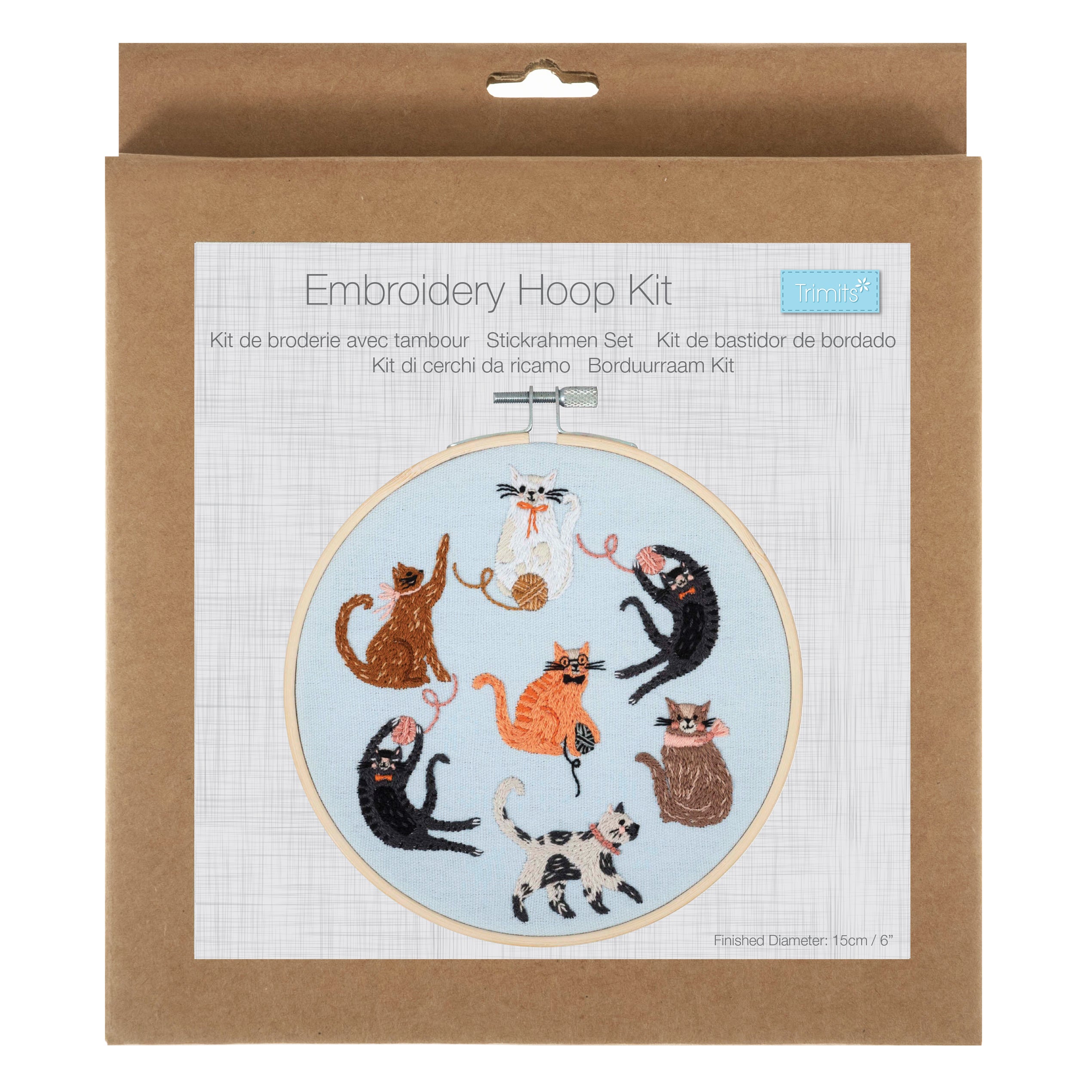 Embroidery hoop kit featuring a pre-printed design of seven playful cats on light blue fabric.
