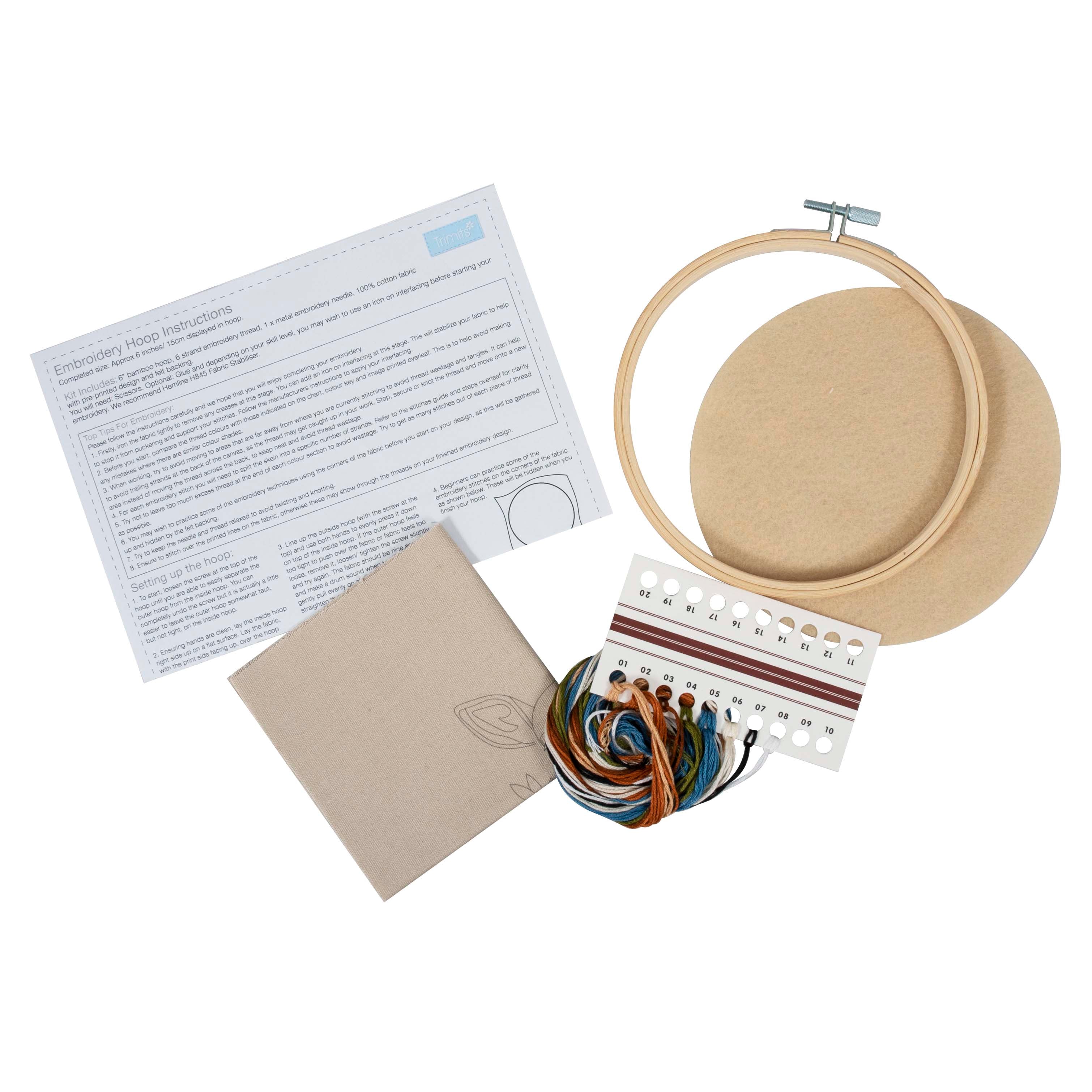 Deer embroidery kit featuring a bamboo hoop, pre-printed fabric, colorful threads, and instructions.