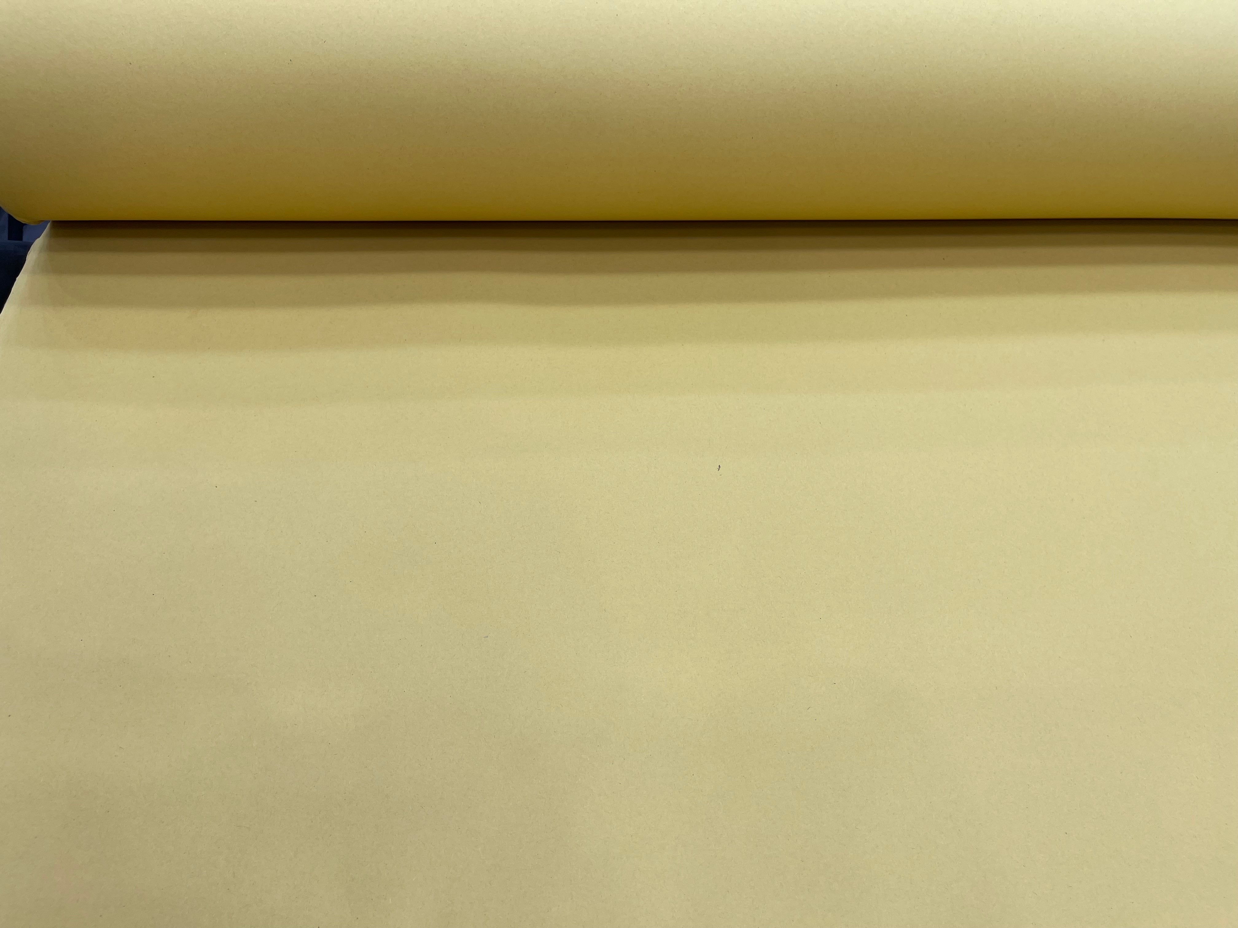 A roll of heavyweight 280 GSM manila board pattern making card in a neutral buff color.