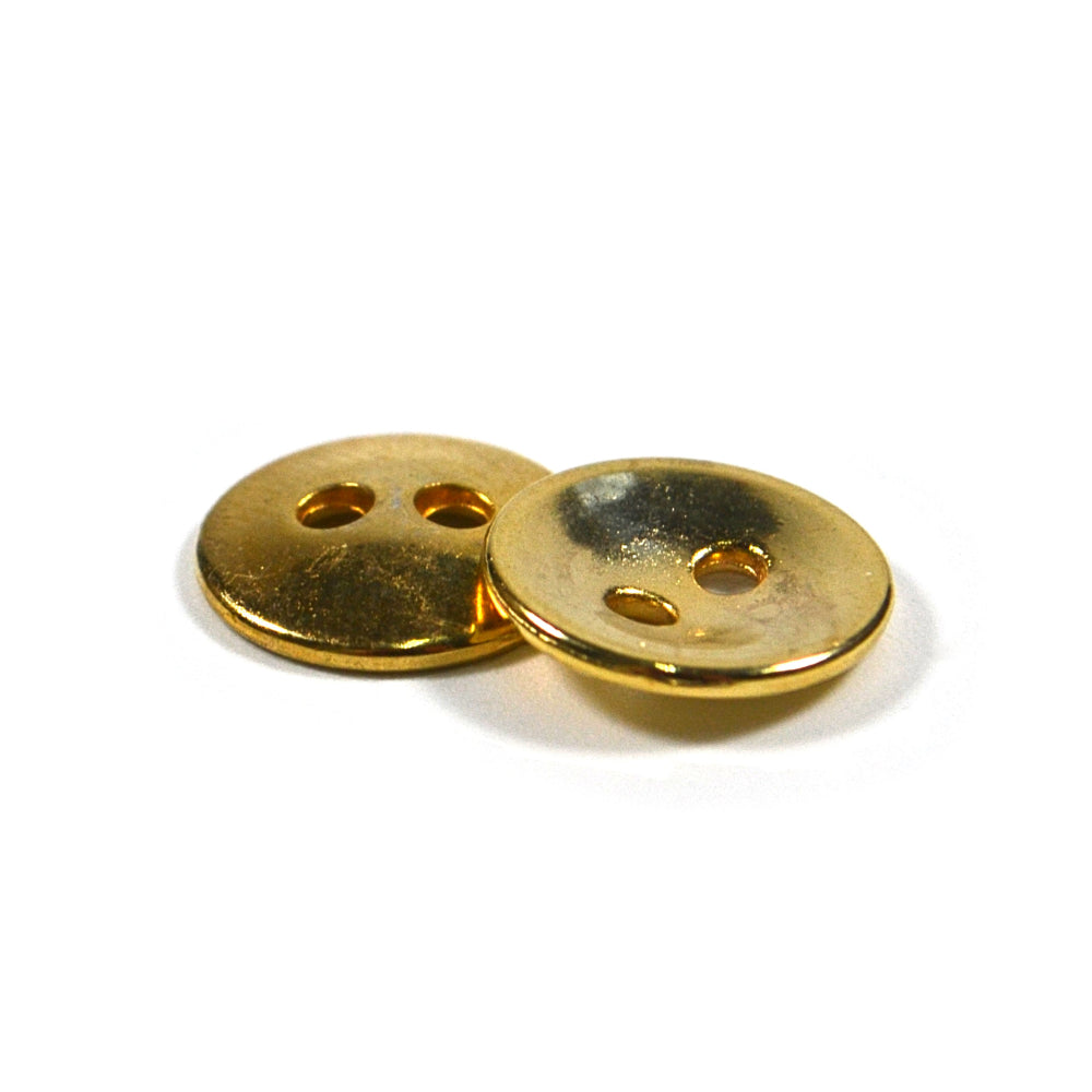 Two gold-colored, cup-shaped metal buttons with two holes on a white background.