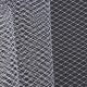 A close-up of grey birdcage veil mesh fabric with a diamond pattern.
