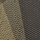 A close-up of gold and black diamond-patterned netting.