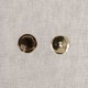 Two round, 21mm enamelled metal buttons, one dark and one silver.