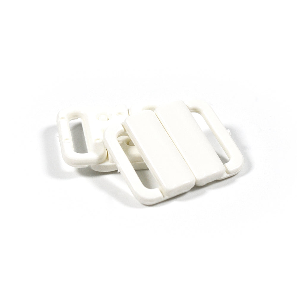 White nylon bra clasps with adjustable fasteners.