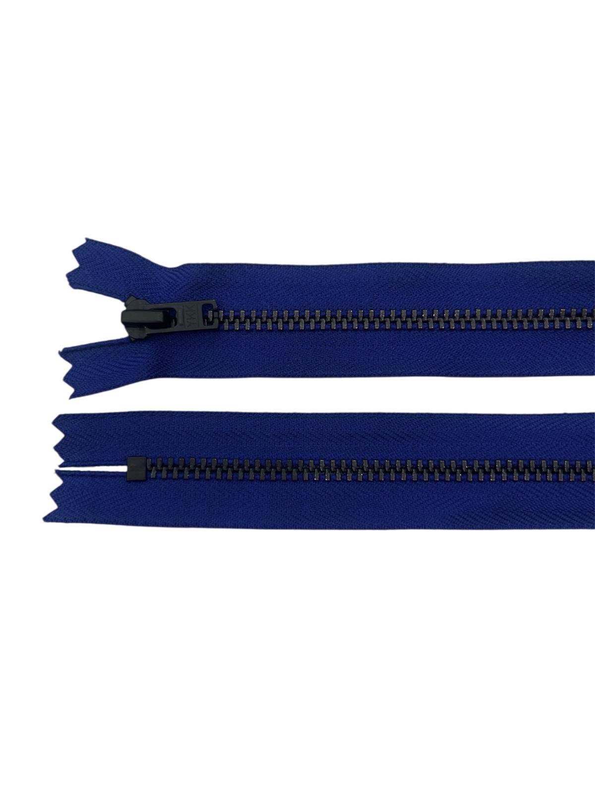 Two navy blue zippers with black metal teeth, one with a black slider and the other closed.