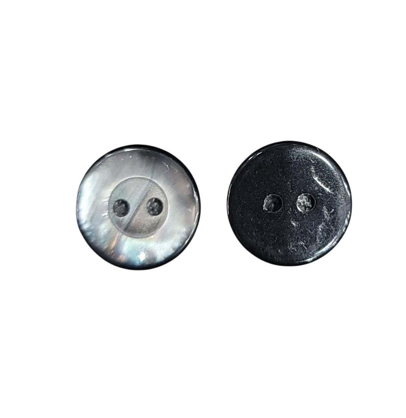 Two 13mm grey shell buttons with two holes, showing iridescent front and dark back views.