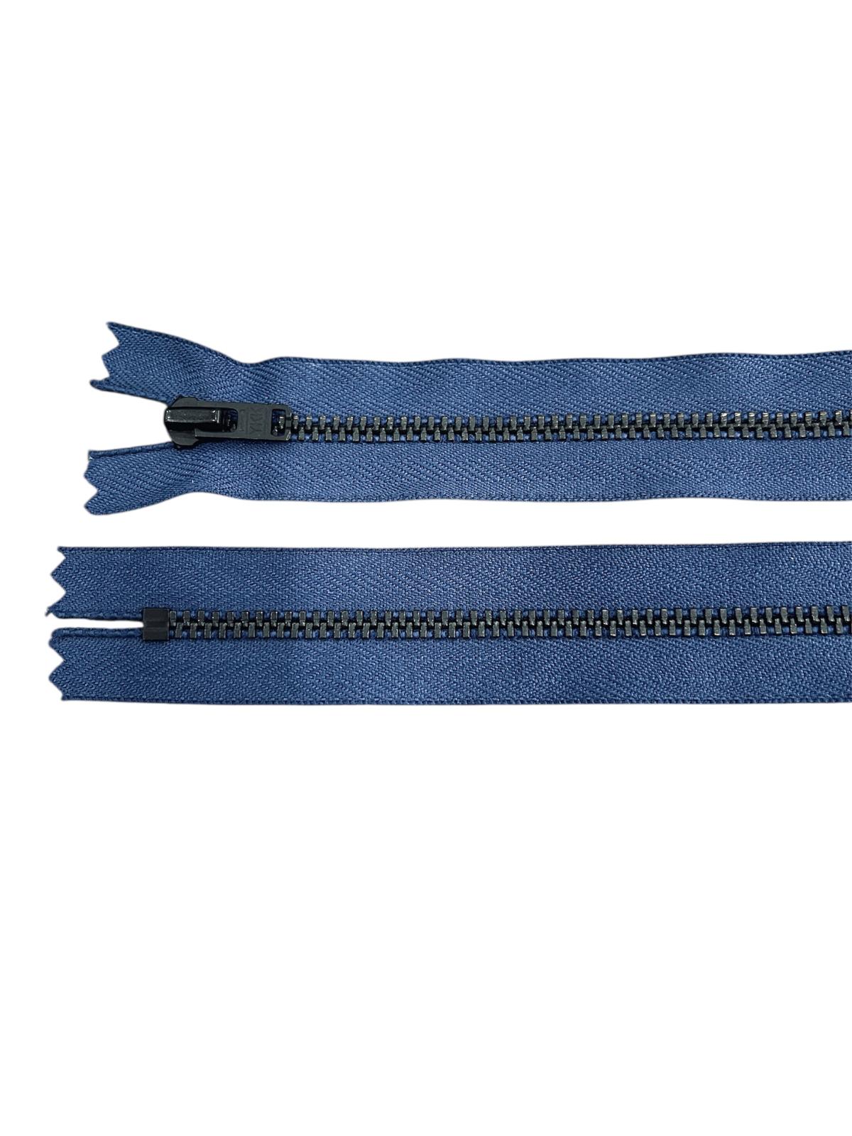 Two blue zippers with black metal teeth and sliders on a white background.